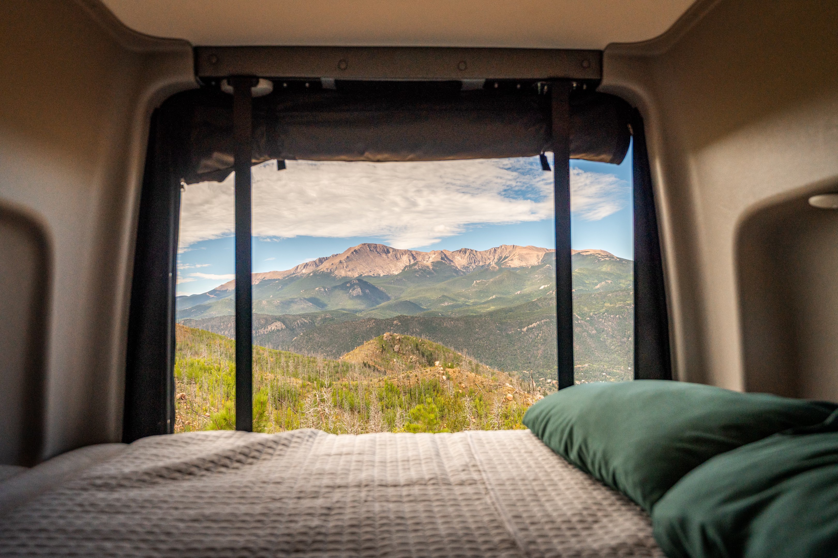 Wake up to breathtaking mountain views from your cozy RV rental! Enjoy nature's beauty right from your bed.. Winnebago Revel 2025