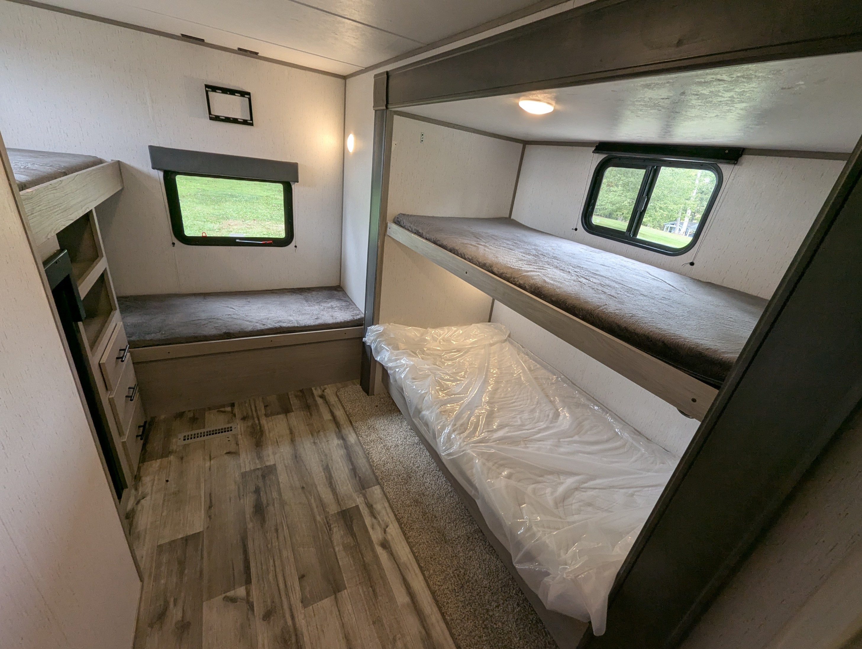 Comfortable RV rental bunk beds, storage, and scenic windows. One mattress is still wrapped for new guests.. Dutchmen Coleman Lantern 2022