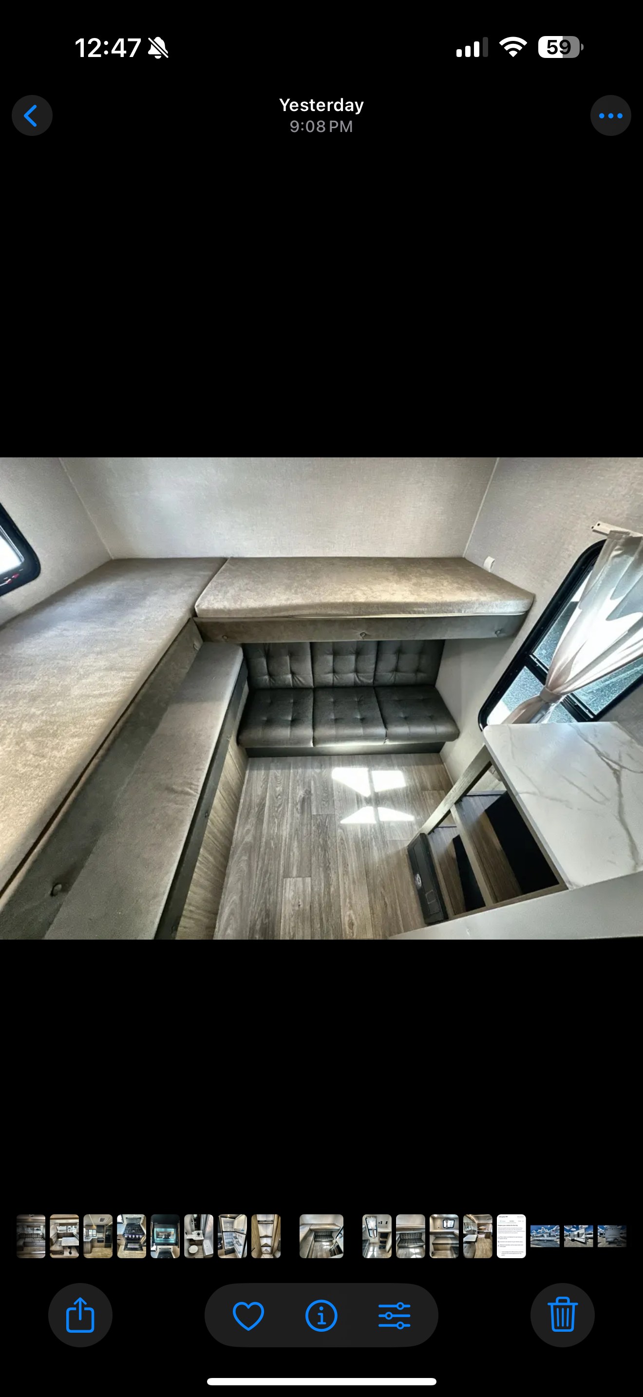 Cozy RV rental interior featuring an L-shaped bench, a bunk bed above, and a separate sofa. Ideal for travel.. Forest River Wildwood X-Lite 2026