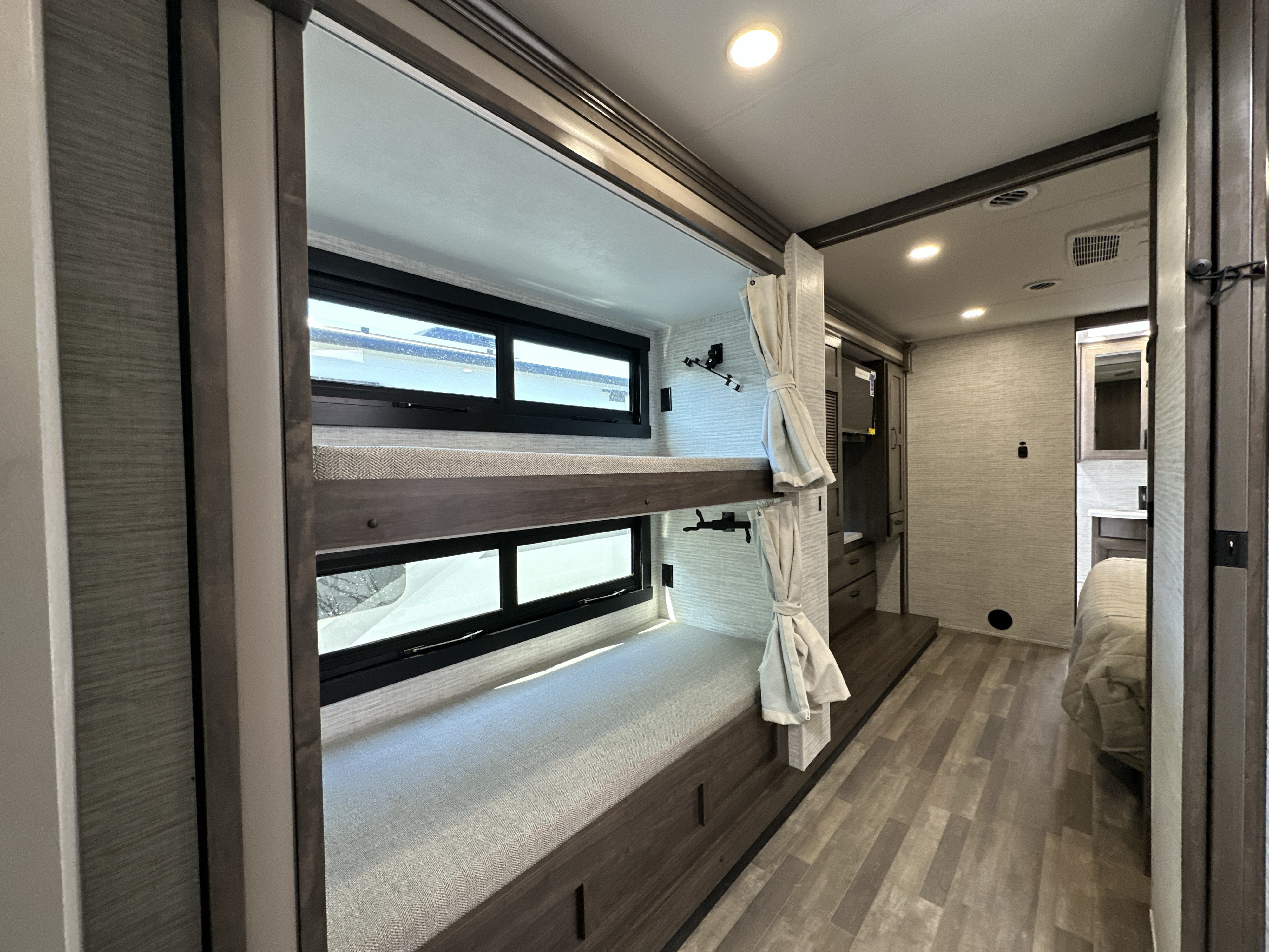 This RV rental offers comfortable bunk beds with windows and privacy curtains, ideal for your next family vacation.. Entegra Coach Vision XL 36A 2025