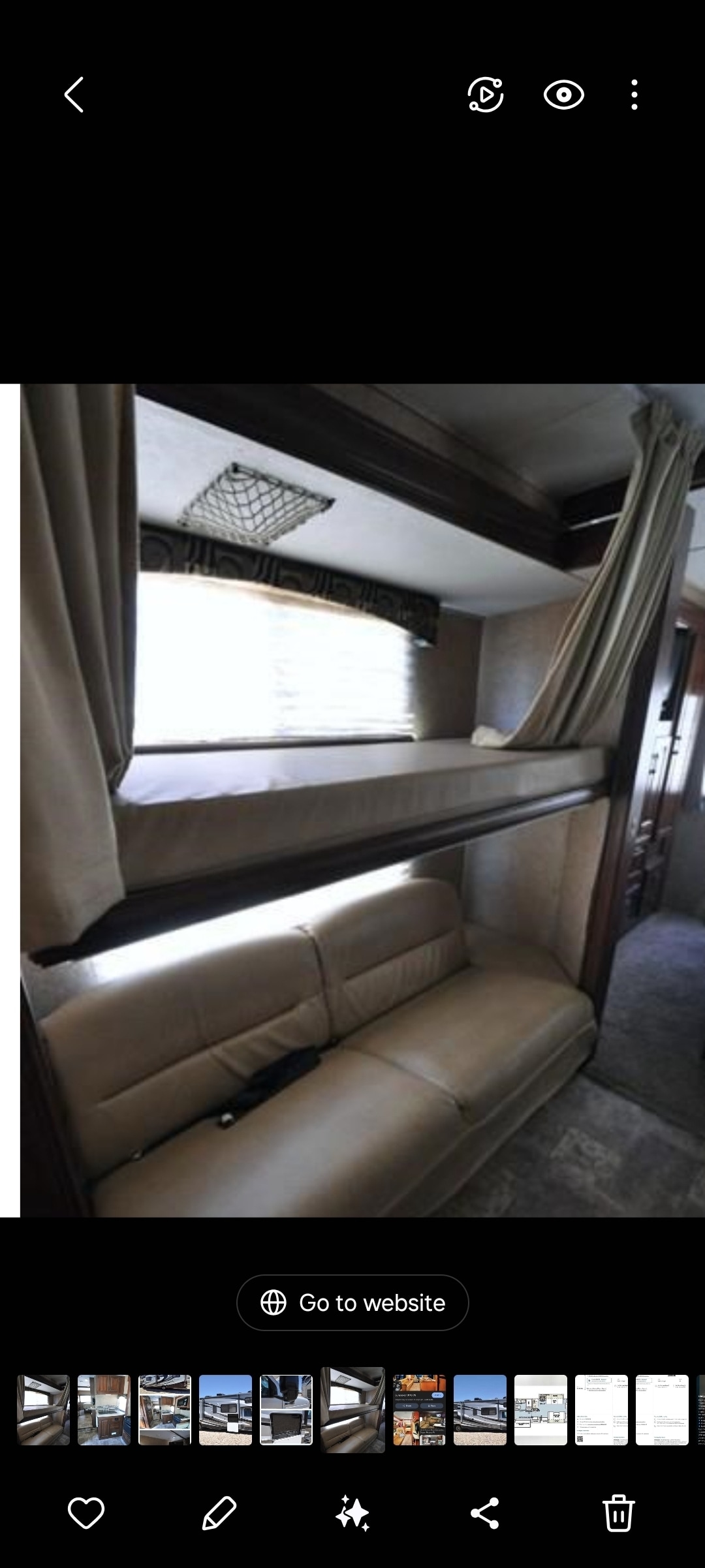 RV rental interior featuring bunk beds, a lower sofa, window with blinds, curtains, and an overhead storage net.. Forest River Sunseeker 2015