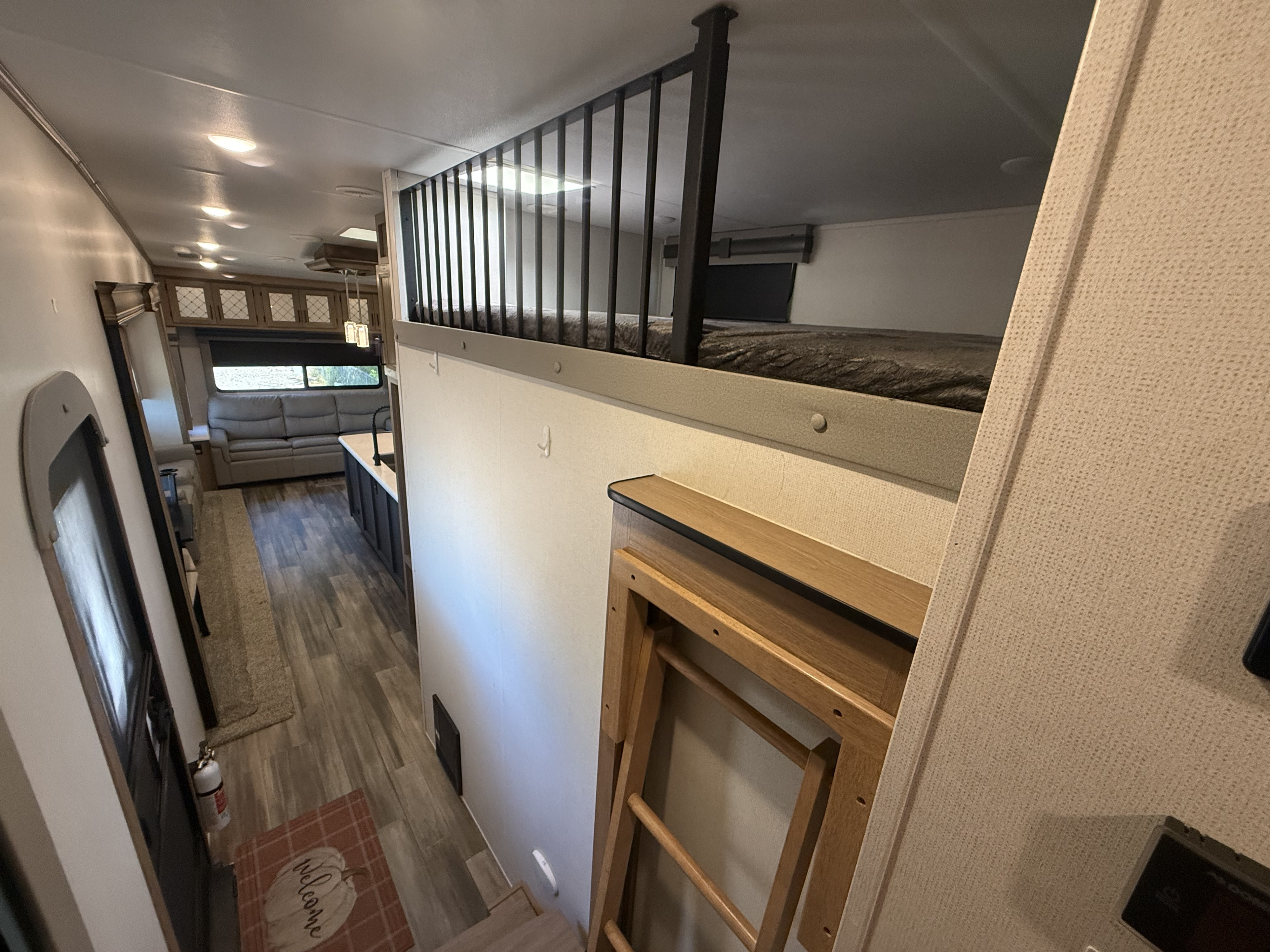 This RV rental boasts a functional interior with a loft bed above a spacious living area and kitchen.. Other Sanibel 3902WB 2022