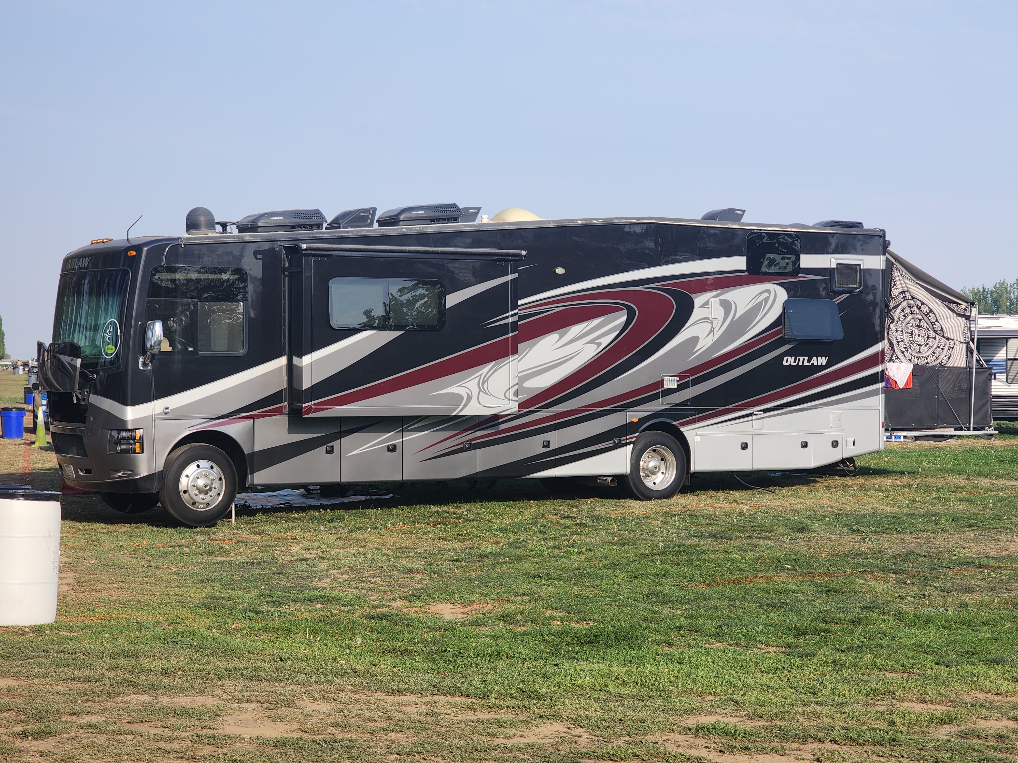 Meet the Outlaw — Class A with a Garage!  Where Freedom Meets Luxury!