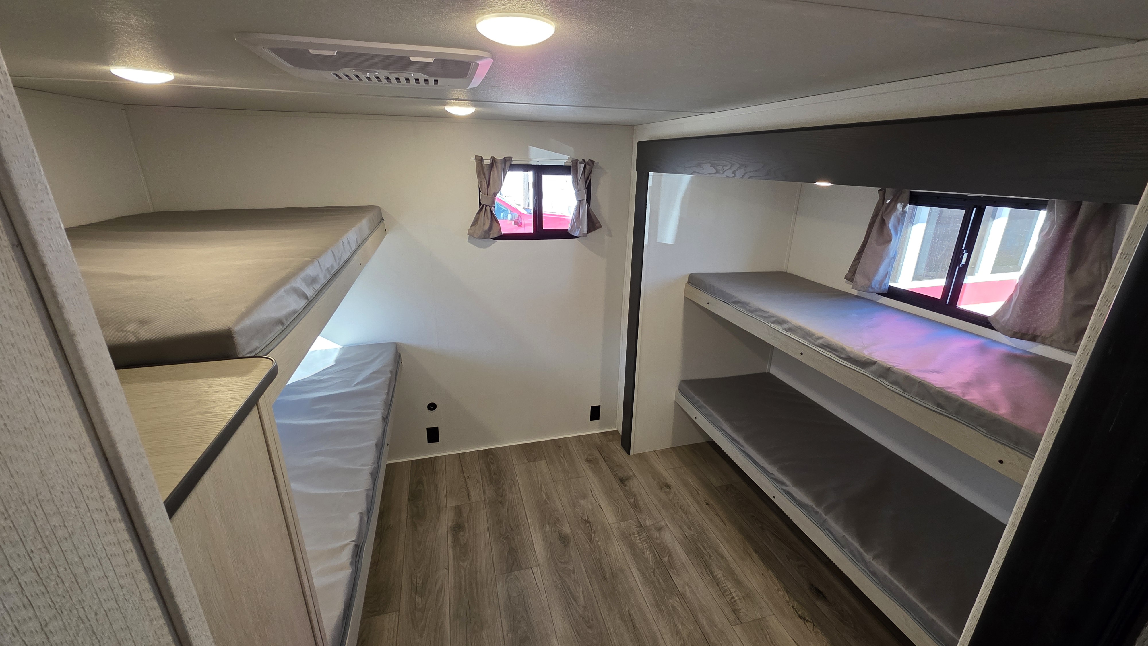 This RV rental features comfy bunk beds for the whole family, with windows, lights, and AC for a great trip.. Forest River Shasta I-5 2025