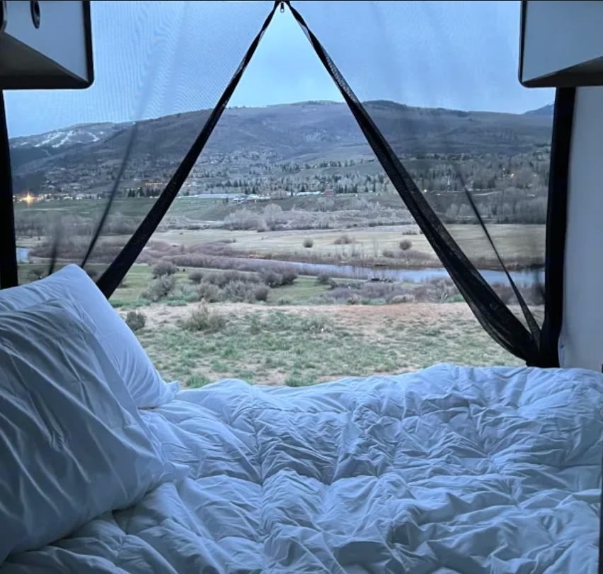 Wake up to stunning mountain & river views in this cozy RV rental! Perfect for nature lovers and travel.. Winnebago Solis 2025