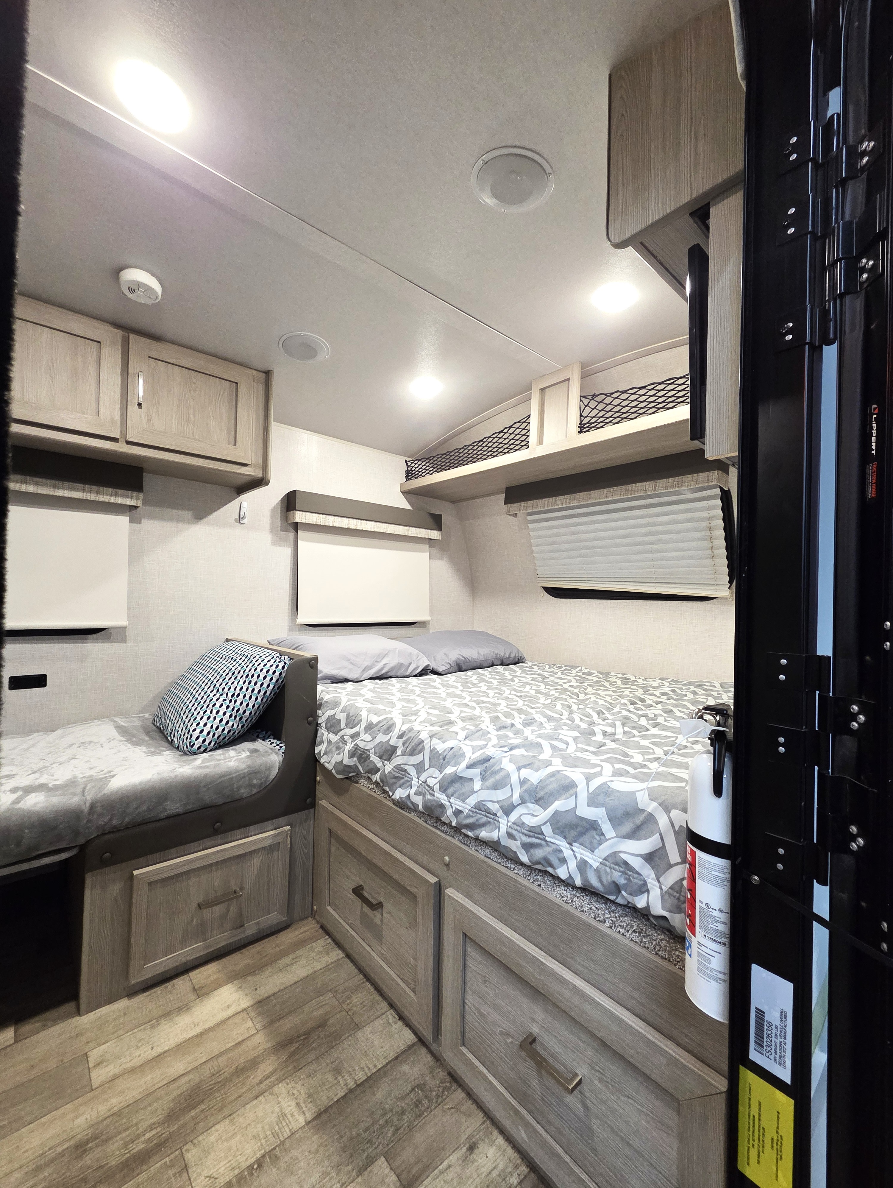 Inside this rv rental, find comfortable sleeping areas with a main bed, side bunk, and practical under-bed storage units.. Forest River Flagstaff E-Pro 2022