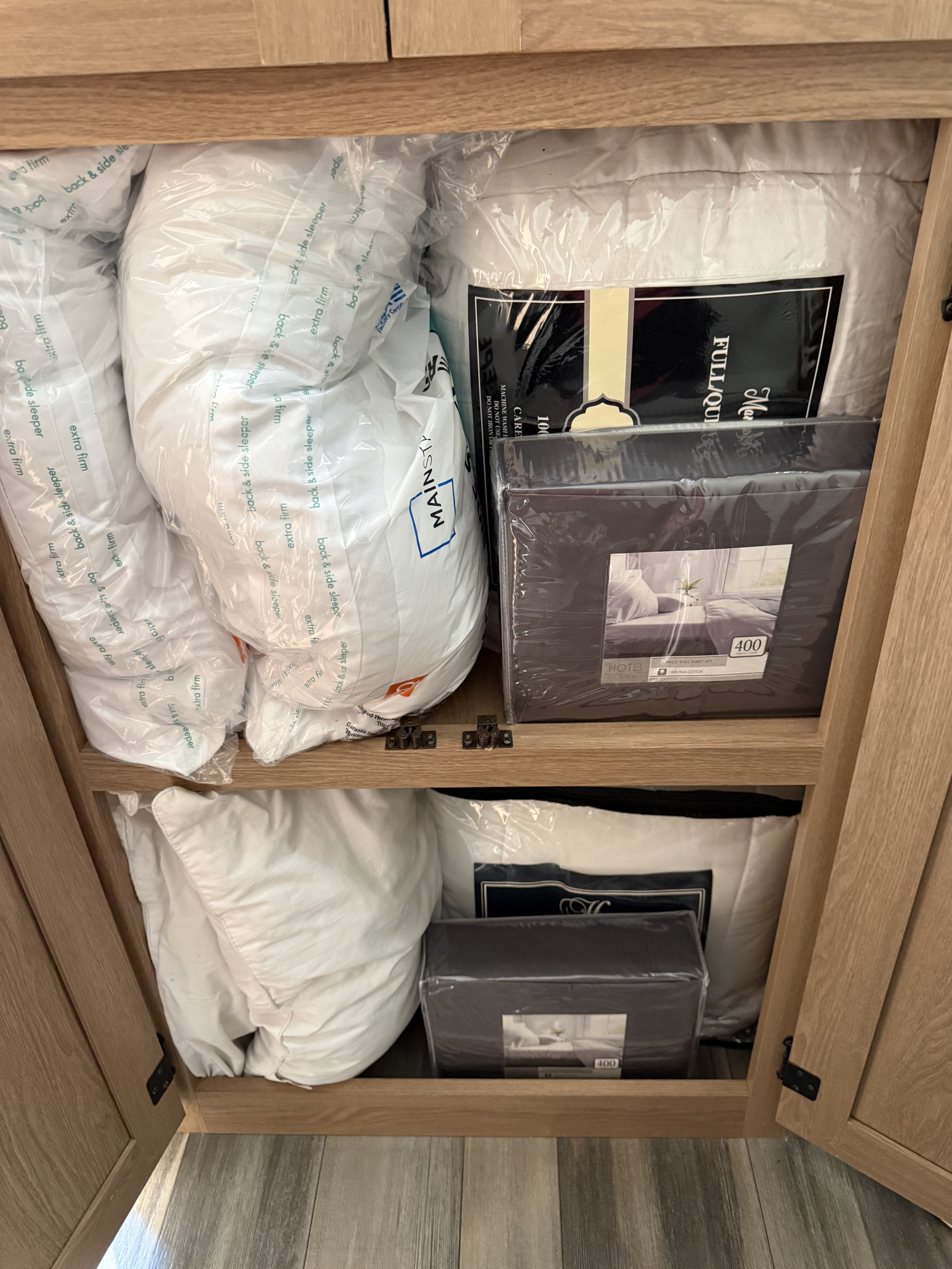 This RV rental cabinet is stocked with fresh bedding: pillows, a full/queen comforter, and Hotel Linen 400-thread count sheets.. Avenger Avenger Trailer 2022