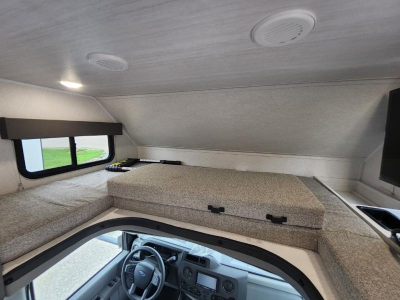 RV rental interior: The spacious cab-over bunk sleeping area and driver's cockpit, offering extra sleeping space.. East to West Entrada 2000NS 2026