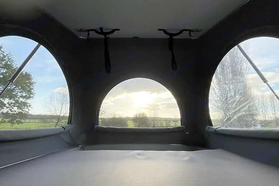 Experience an RV rental! Relax in this camper van's pop-top sleeping area with panoramic views of nature and sky.. Volkswagen summer 2024
