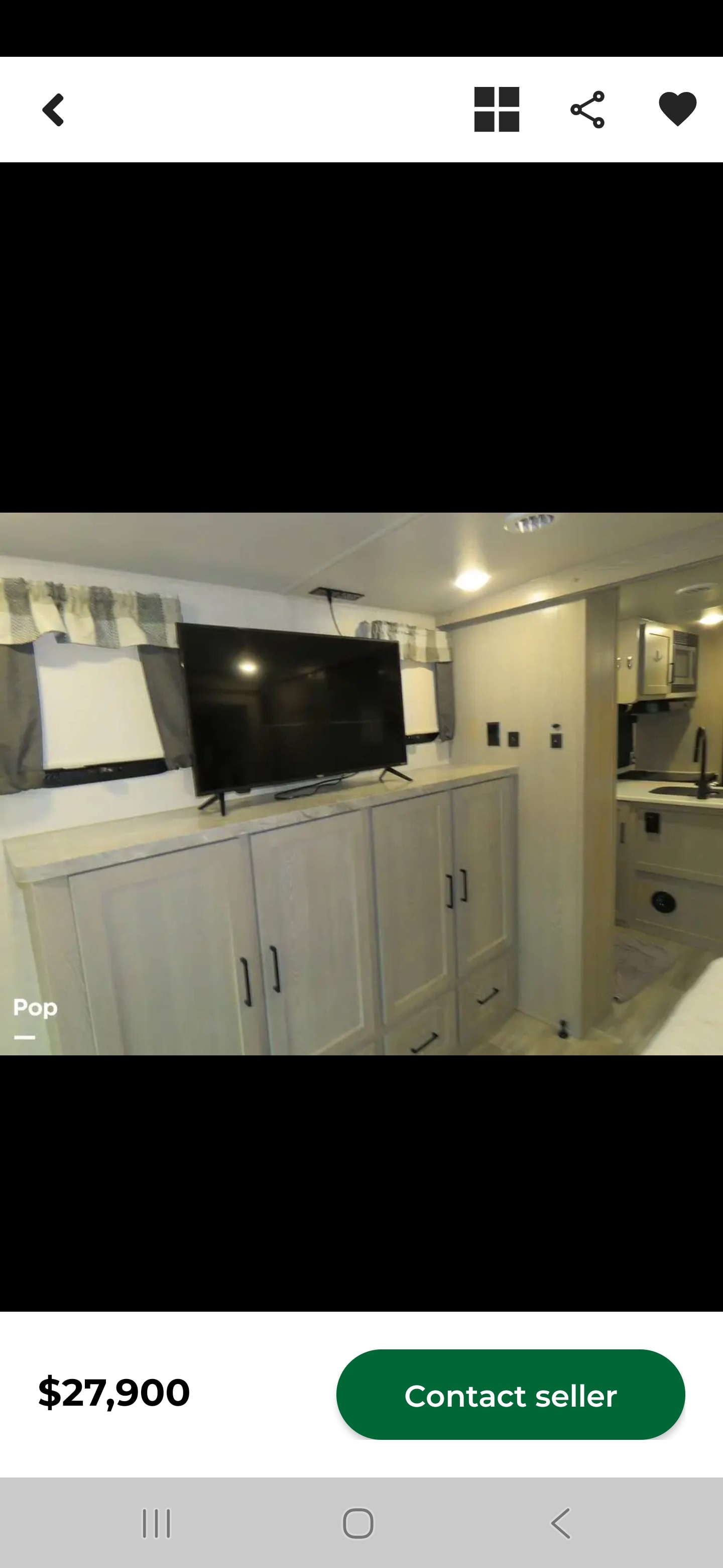 Spacious RV rental interior: Modern design with TV, ample light wood cabinets, and a partial view of the kitchen area. Price: $27,900.. Forest River Flagstaff Super Lite 2021