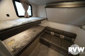This RV rental's adaptable interior offers bunk beds, a sofa, and a fold-down bed for flexible sleeping arrangements.. Forest River Salem 2024
