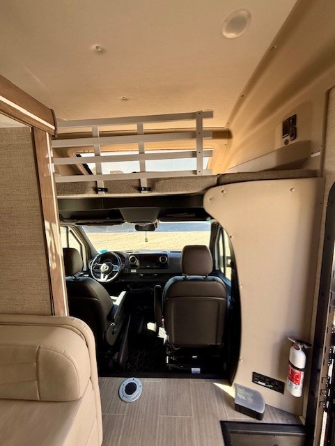 RV rental interior view: front cabin, overhead bunk with safety rail, and main living area for comfortable travel.. Jayco Melbourne Prestige 2023