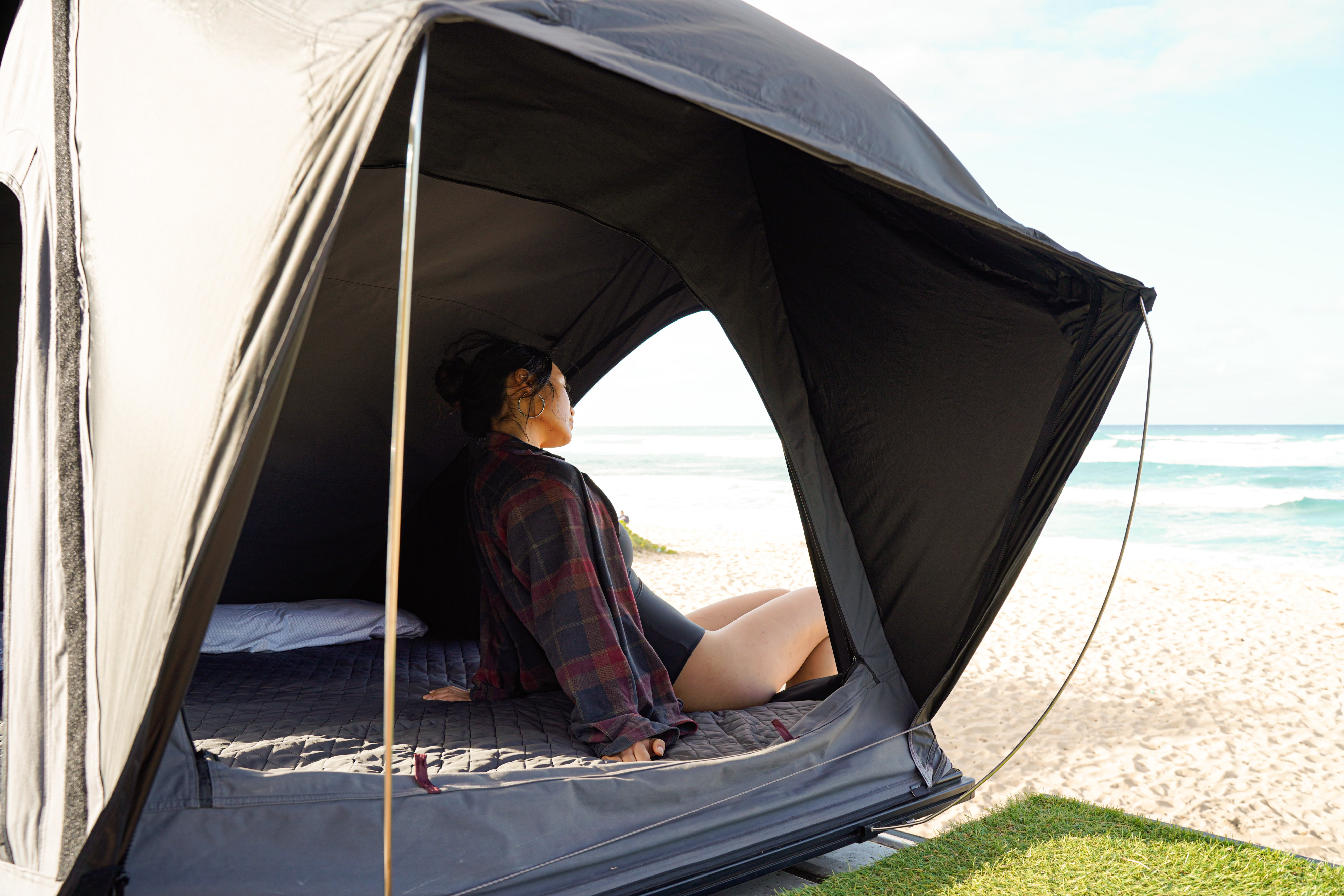 Relax in an RV rental rooftop tent, admiring the beach & ocean view. Ideal for coastal camping adventures.. Ford Econolline 250s 2005