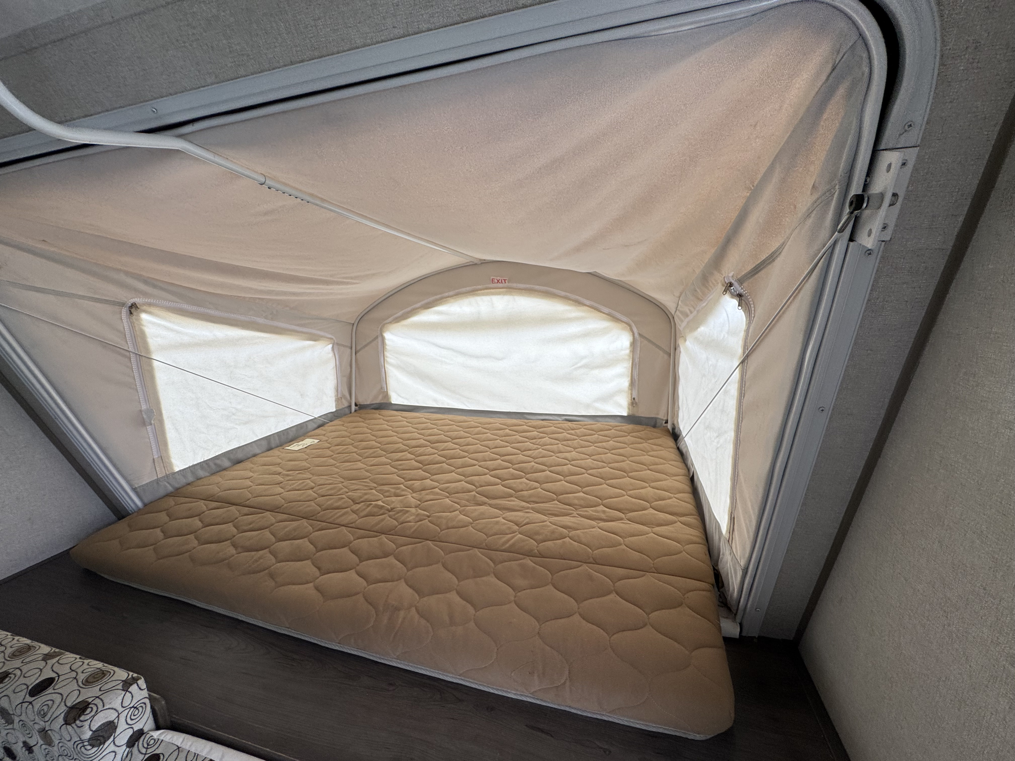 RV rental pop-up bed features a quilted mattress, canvas windows & walls for a bright, comfortable sleep area.. Coachmen Clipper 2019
