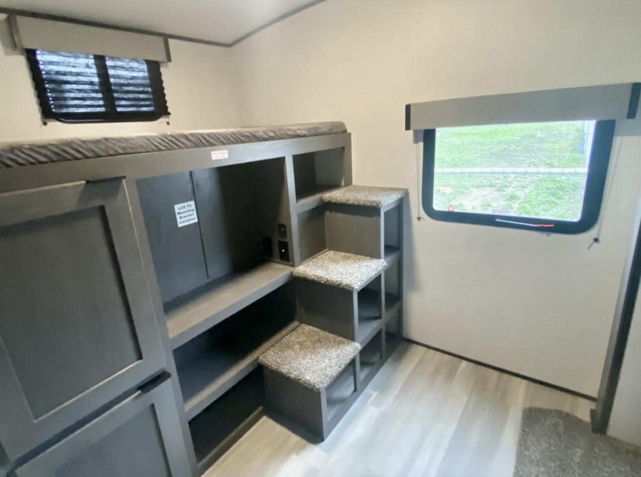 RV rental: interior bunk beds with storage steps & TV mount area, perfect for family adventures.. Heartland Mpg cruiser 2022