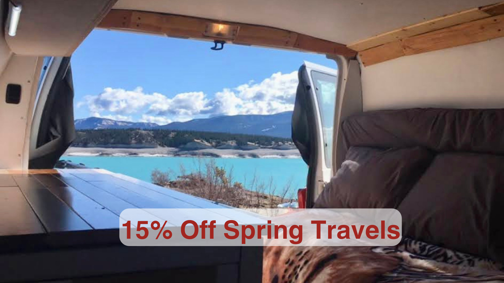 Cozy rv rental interior with a stunning view of a turquoise lake & mountains. Perfect for spring travel, now 15% off!. Ford Econoline 2009