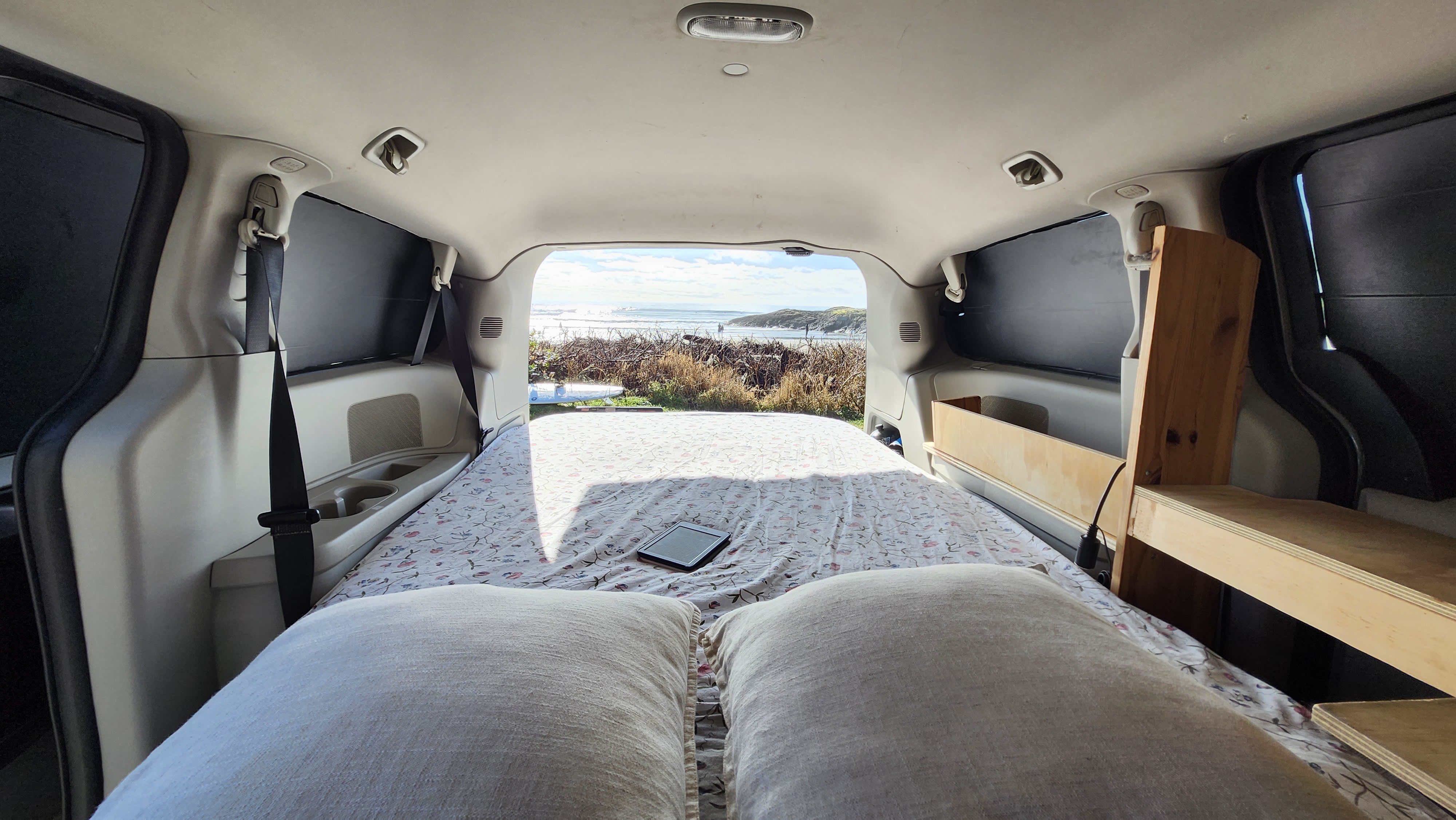 Experience the ultimate freedom of an rv rental! Inside this cozy camper van, a comfy bed with an e-reader offers ocean views.. Chrysler Dodge Grand Caravan 2015