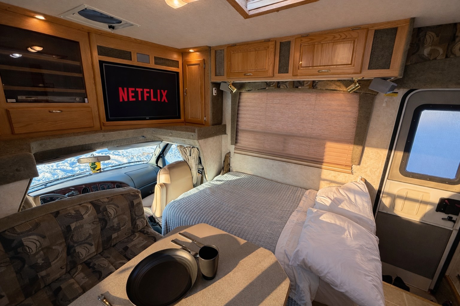 Relax in this cozy RV rental with Netflix, a comfy bed, and a scenic snowy view, perfect for your next adventure.. Bigfoot RV Bigfoot RV Motorhome 2004