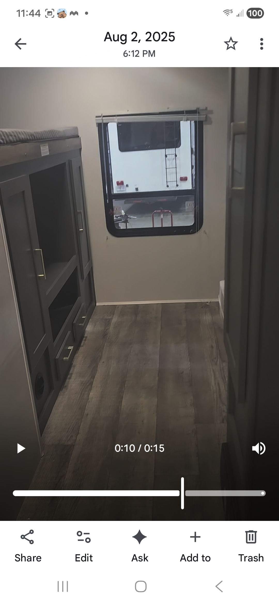 RV rental interior: bunk bed, dark grey storage unit with gold handles, light walls, and a window looking out. Wood-look floor.. Eddie Bauer Eddie Bauer 2024