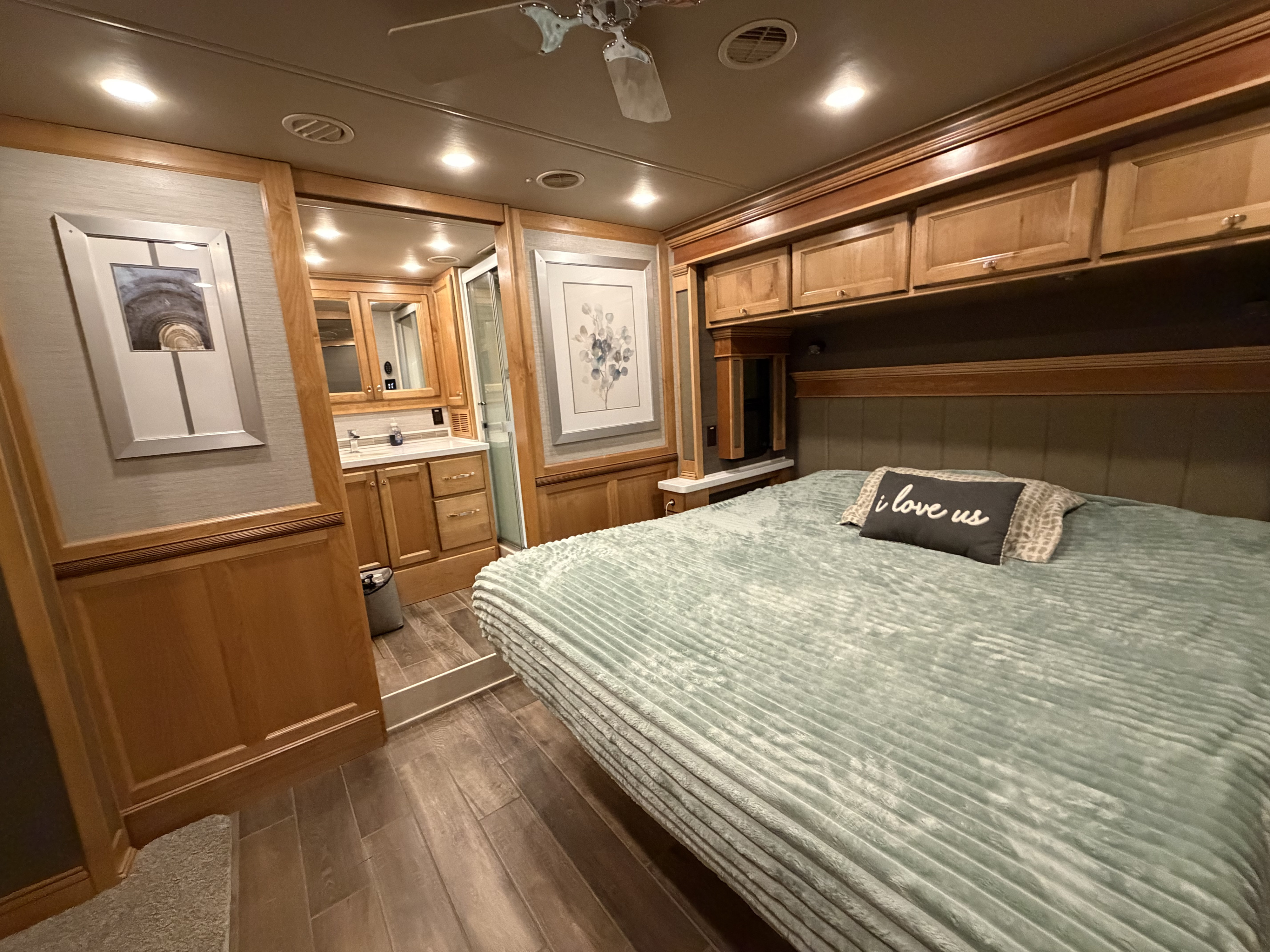 RV rental interior with a cozy bedroom, plush bed, wood cabinetry, and an adjacent full bathroom.. Allegro Allegro Red 360 2022