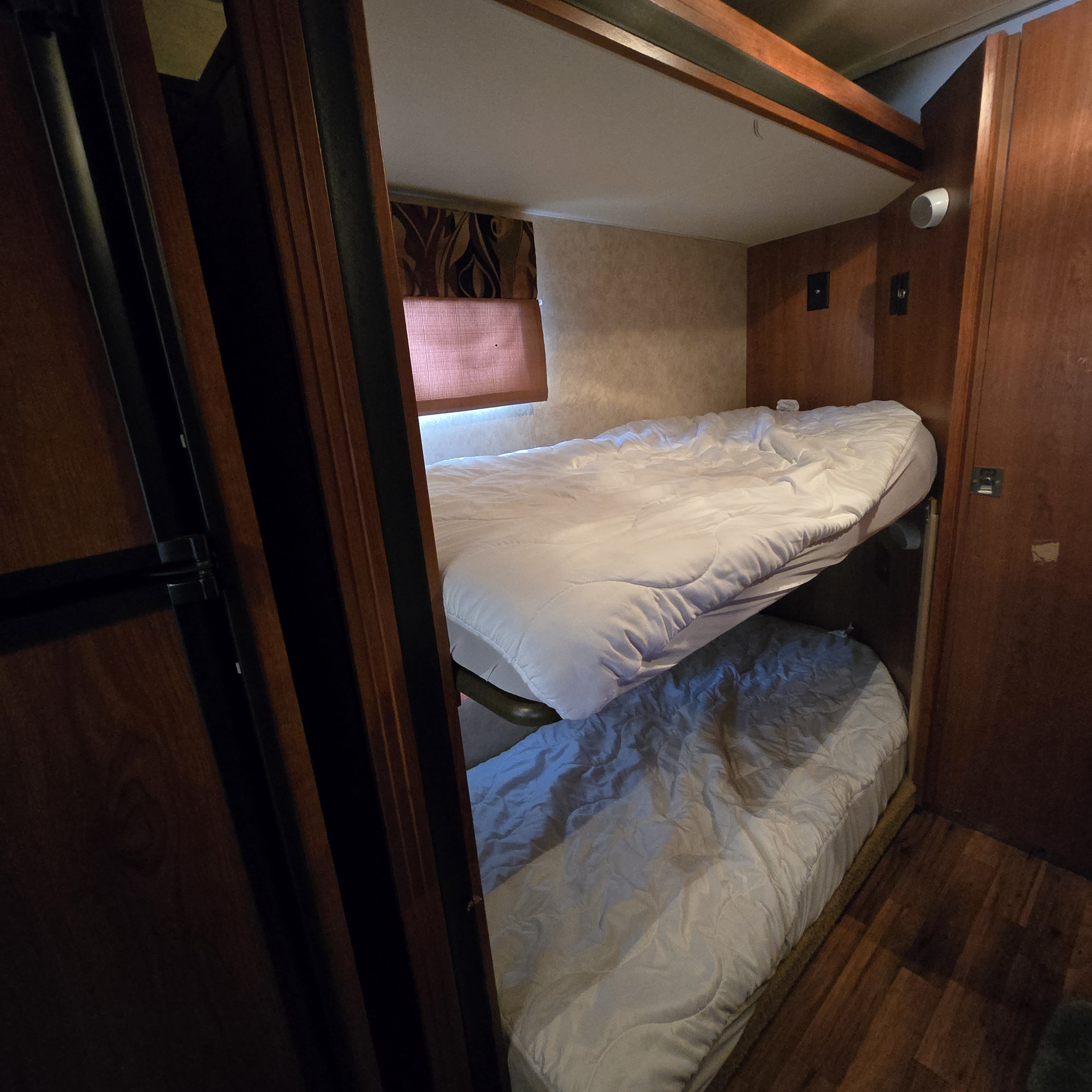 Comfortable bunk beds in an RV rental, offering cozy sleeping accommodation for your next road trip adventure.. Coachmen Freelander 2011