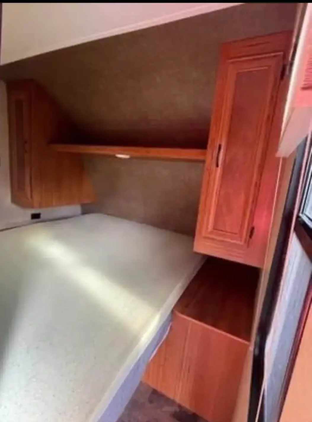 Cozy RV rental bedroom with a comfy bed, overhead shelf, and storage cabinets. Ideal for your next adventure!. Starcraft AR-One Maxx 2017