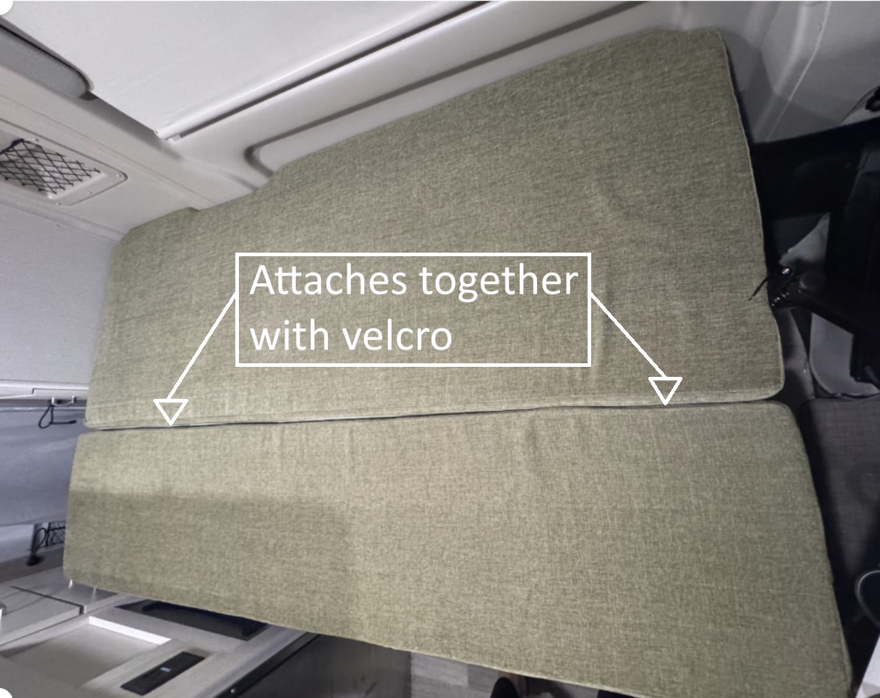 RV rental interior shows two green cushions that attach with velcro, offering flexible seating or sleeping options.. Thor Rize 2023
