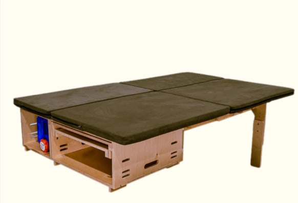 Modular wooden sleeping platform for RV rental or van life, featuring cushions, storage, and an adjustable leg.. Dodge B Van 2008