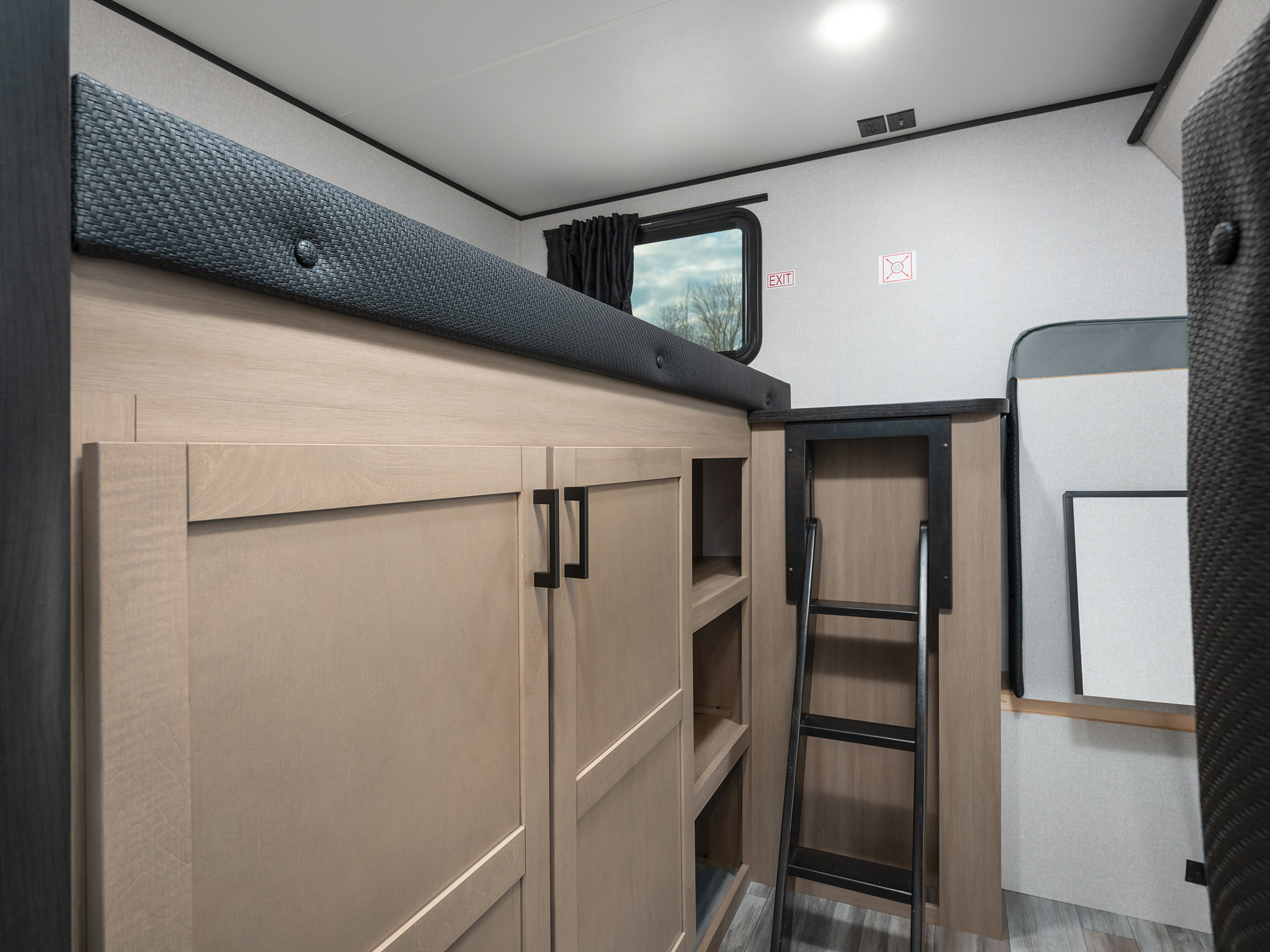 Cozy RV rental interior with bunk beds, cabinets, and ladder, offering comfortable sleeping arrangements and storage.. Jayco Jay Flight 2026