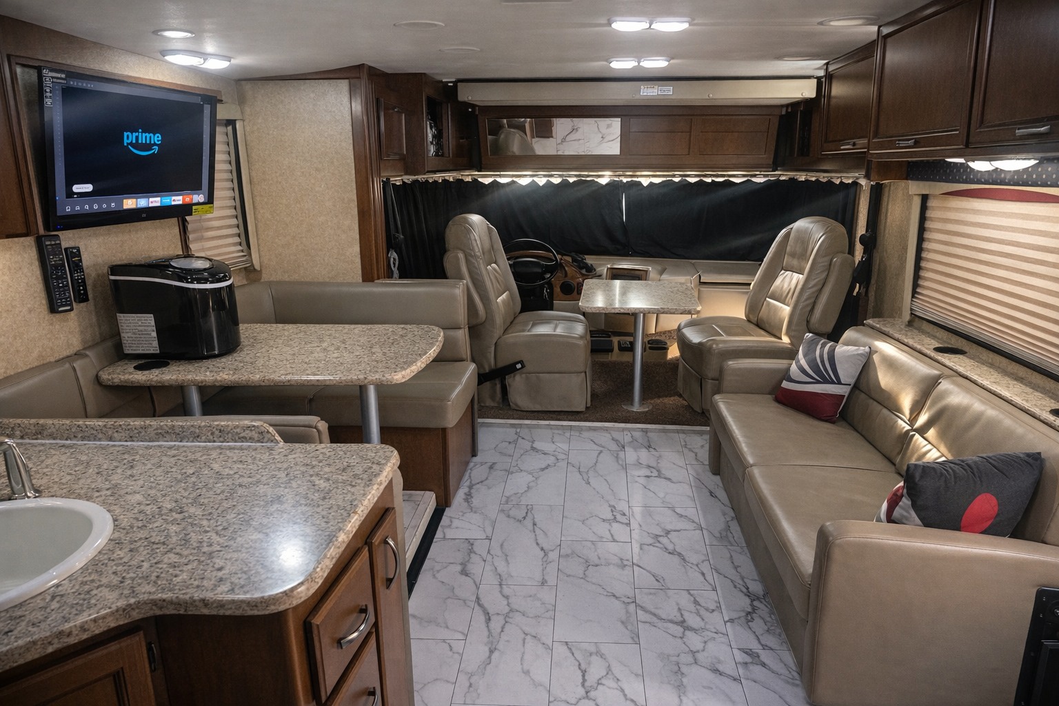 rv rental: Modern RV interior features a kitchen counter, dining booth, entertainment TV, and plush seating for travel comfort.. Thor A.C.E 30.2 2014