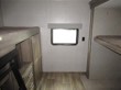RV rental interior: A bunk bed area with two bunks visible, a bright window, and light wood-look flooring.. Dutchmen Aspen Trail 2019