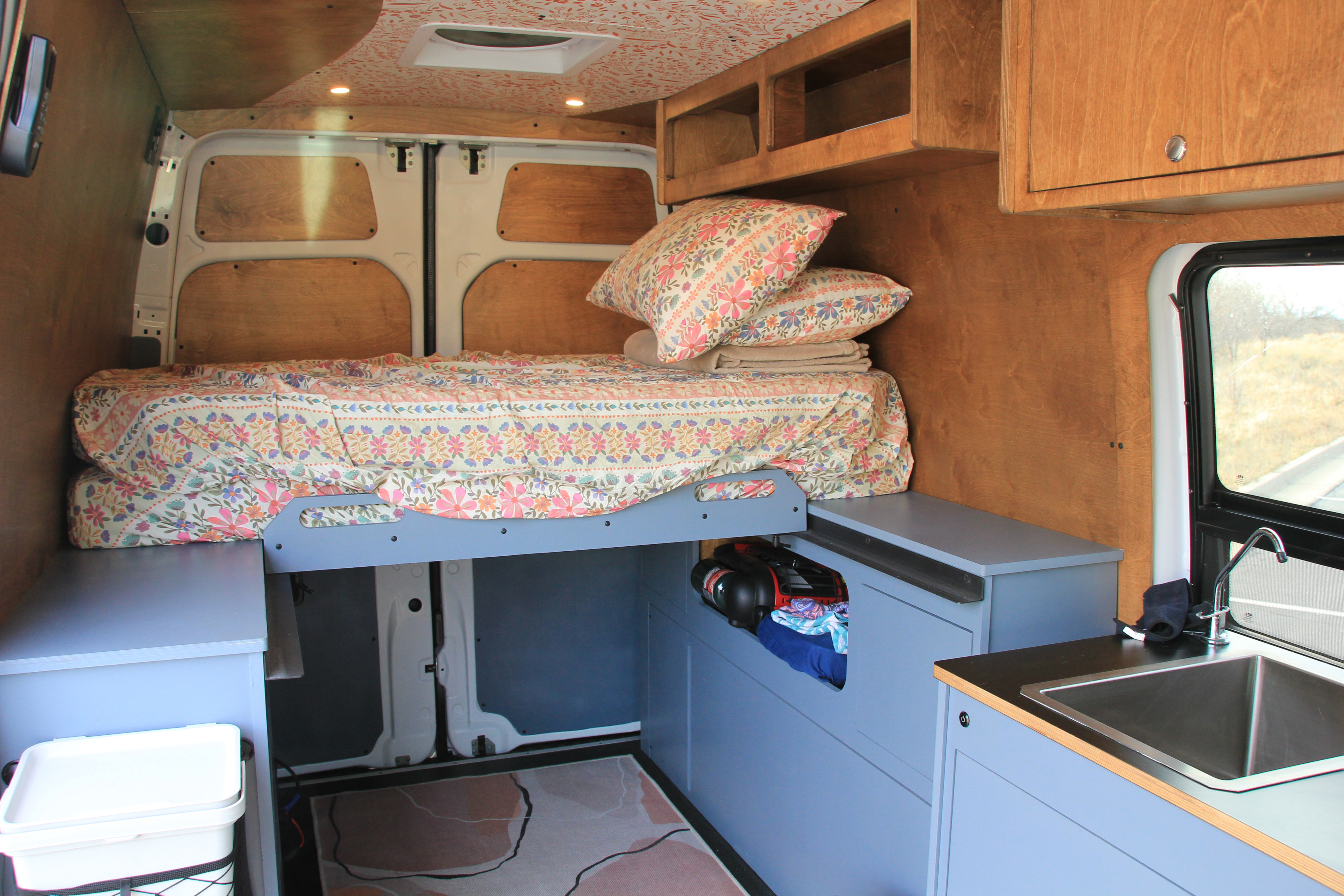 This rv rental features a well-designed camper van interior with a comfy bed, kitchen sink, and ample storage.. Mercedes-Benz Sprinter 2018