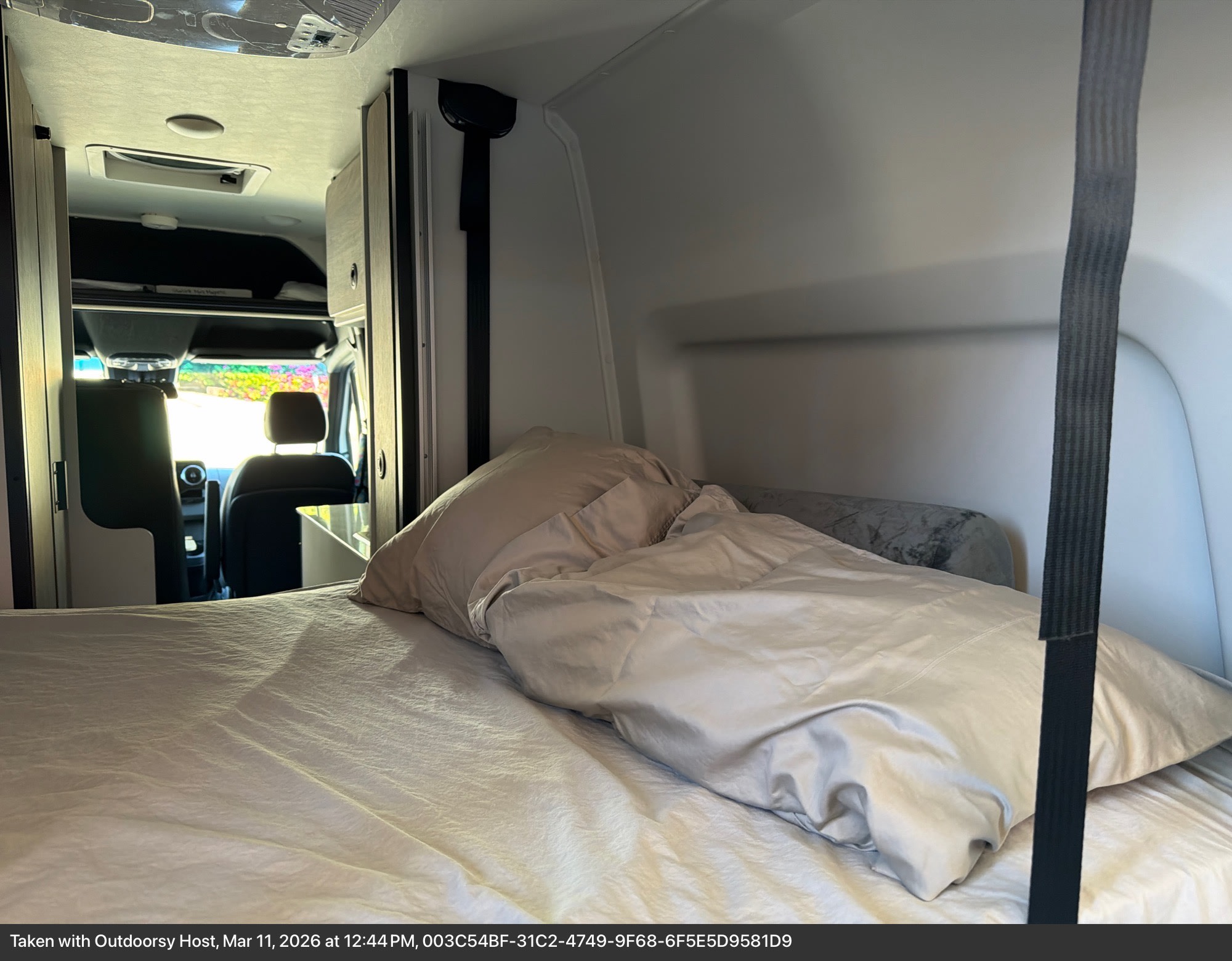 Comfortable RV rental bed and inviting interior cabin view, offering a cozy sleeping area for your next adventure.. Tiffin GH1 2025