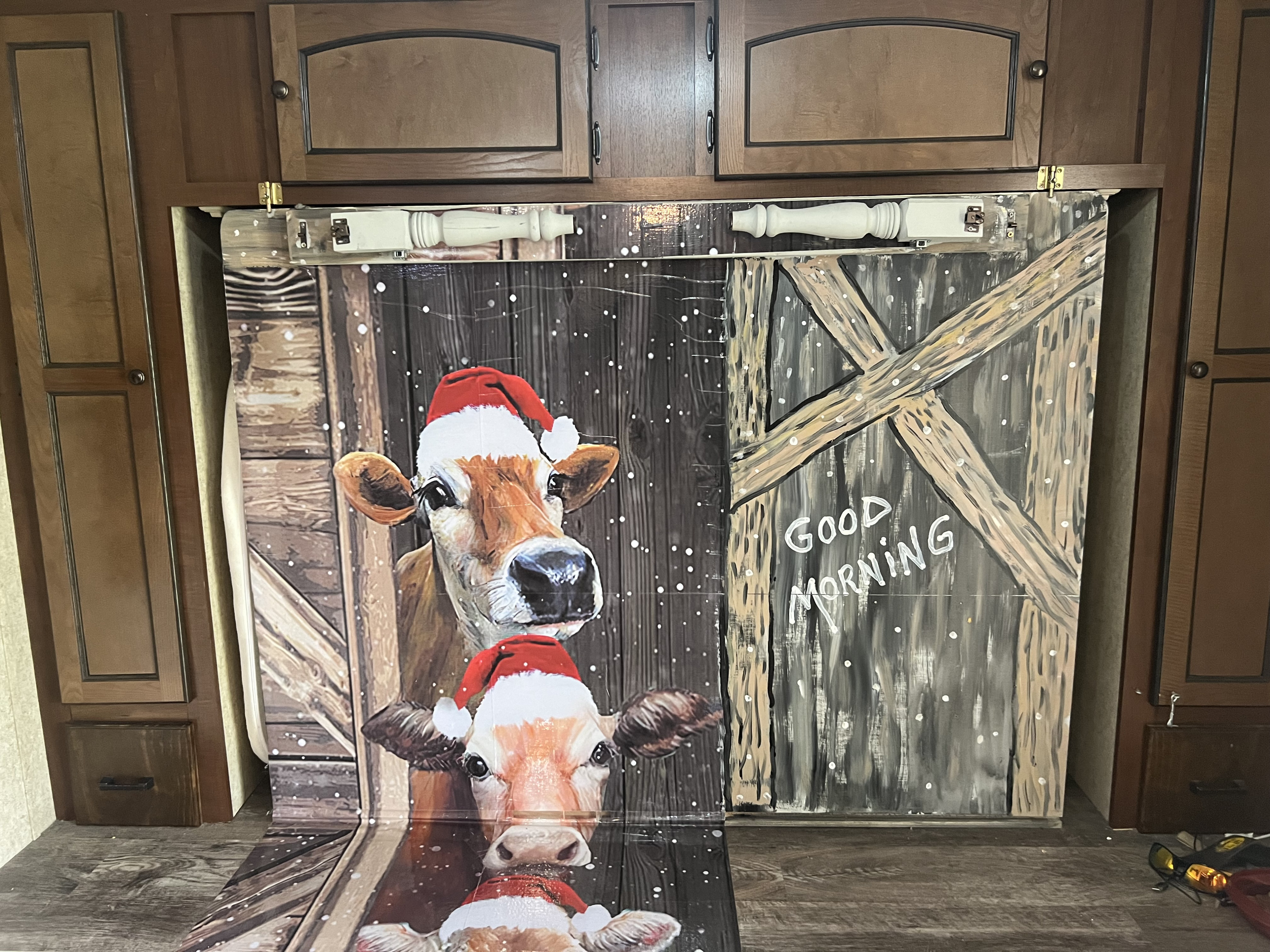 Festive RV rental interior: Custom cow decoration with Santa hats and 'Good Morning' adds holiday cheer to the bunk area.. Nomad Nomad Trailer 2015