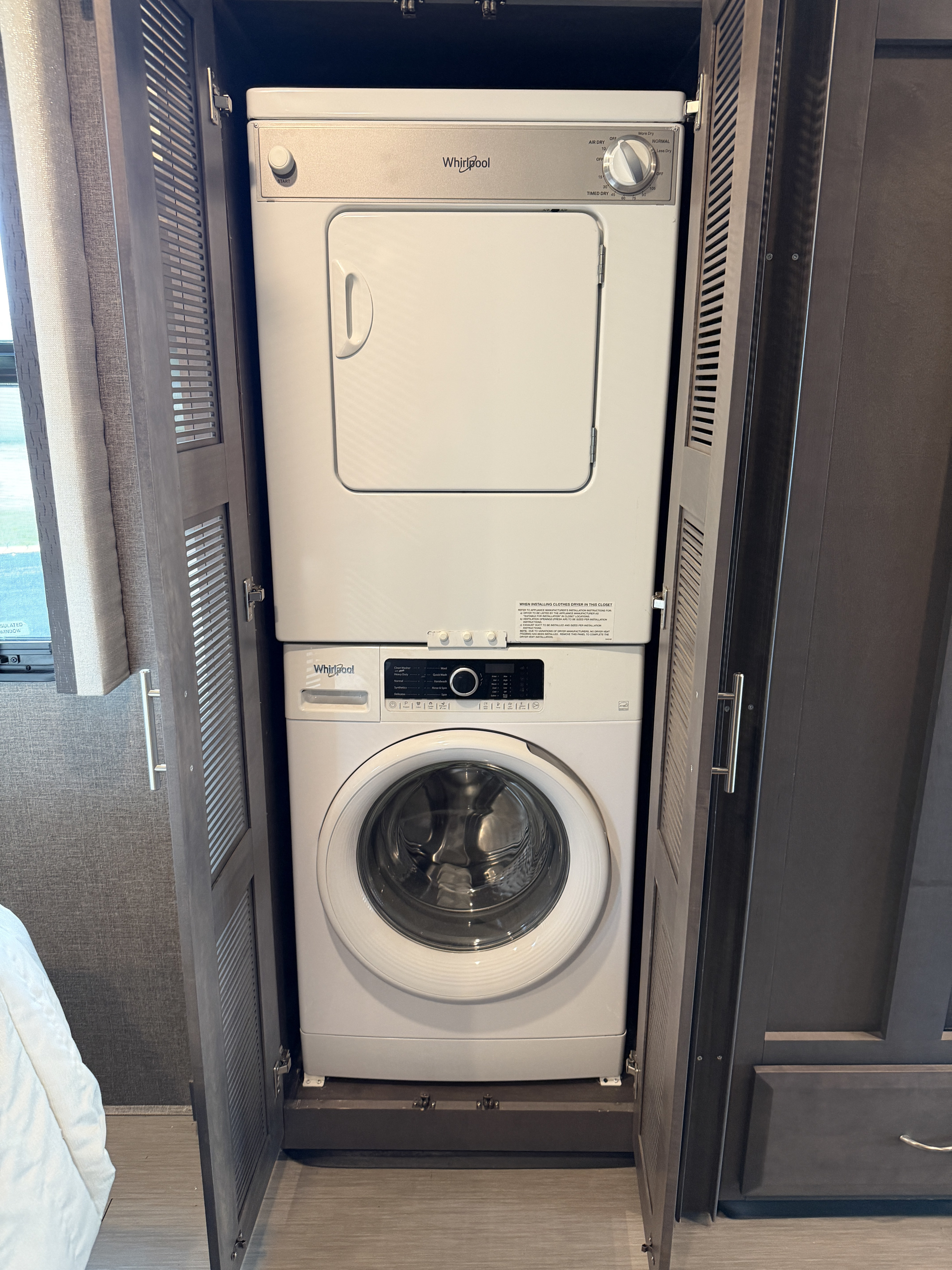 This rv rental offers convenient on-board laundry with a compact, stacked Whirlpool washer and dryer unit.. Thor Palazzo 2022