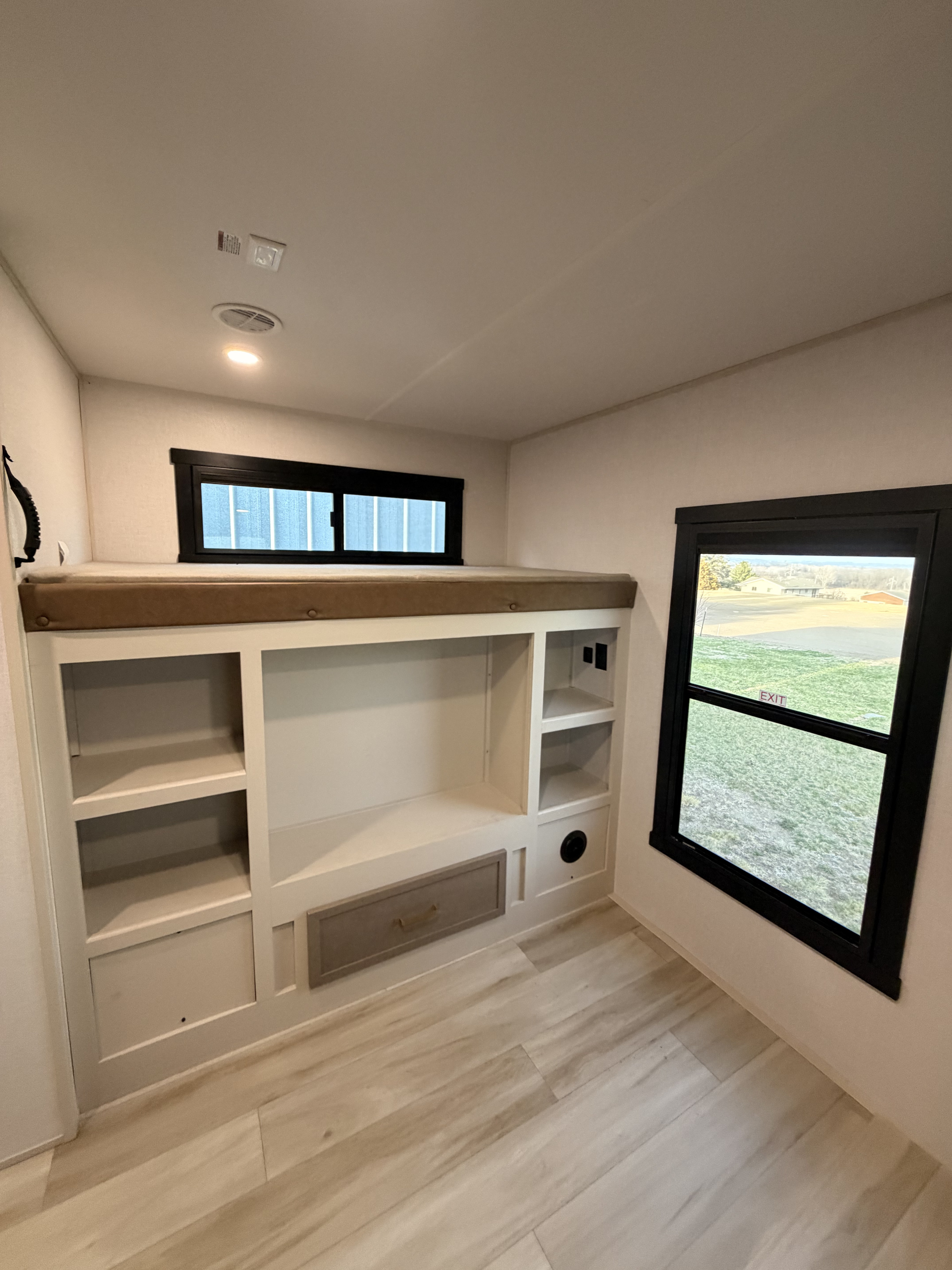 This RV rental offers a spacious bunk bed with built-in storage and two windows, ideal for a comfortable family adventure.. Forest River Salem Hemisphere 2026