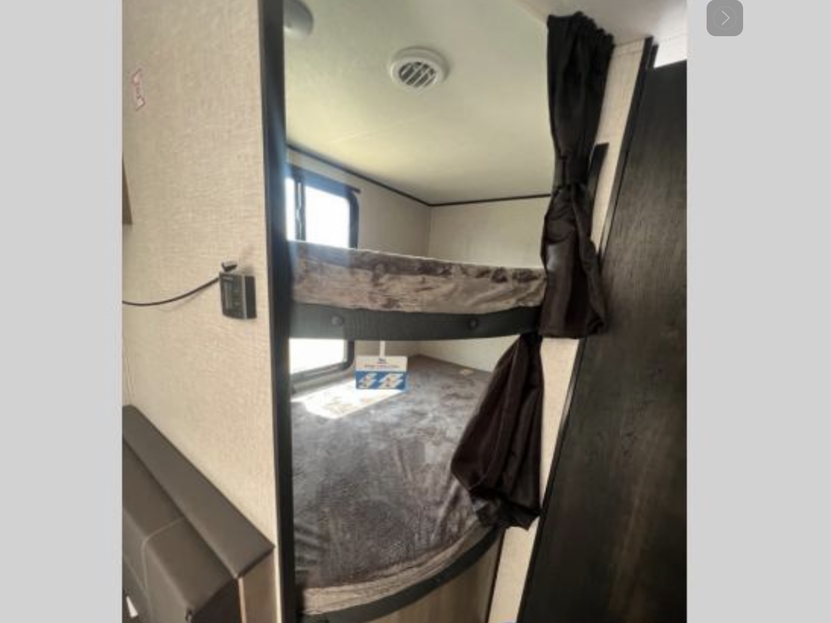 RV rental interior with comfortable bunk beds. A compact sleeping area, perfect for family adventures on the road.. Jayco Jay Flight 2024