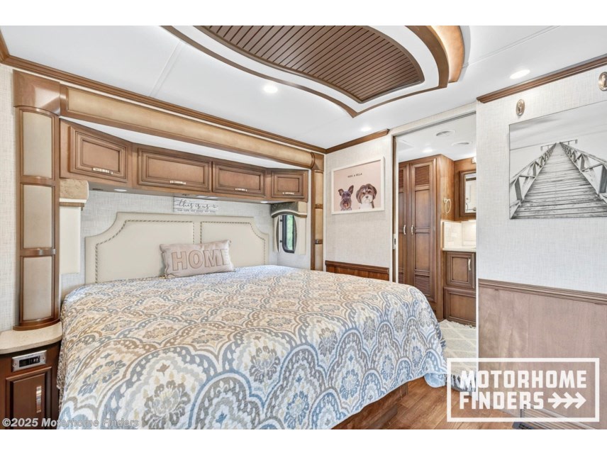 Relax in this luxurious motorhome bedroom, ideal for your next rv rental. Features a comfy bed, storage, and modern design.. Kountry Star Kountry Star Motorhome 2021