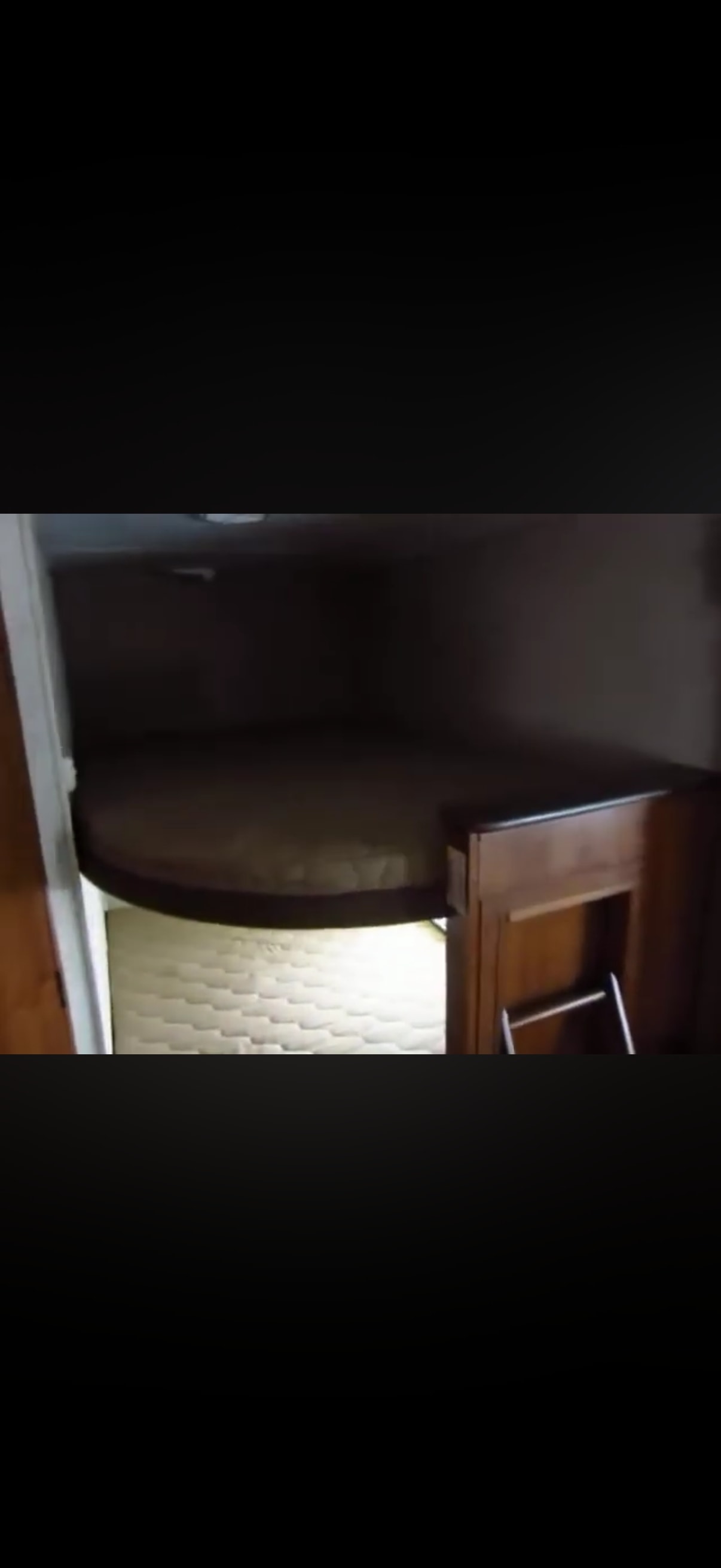 An RV rental's interior: comfortable bunk beds with a ladder, ideal for compact sleeping.. Heartland RVs Trail Runner 2014