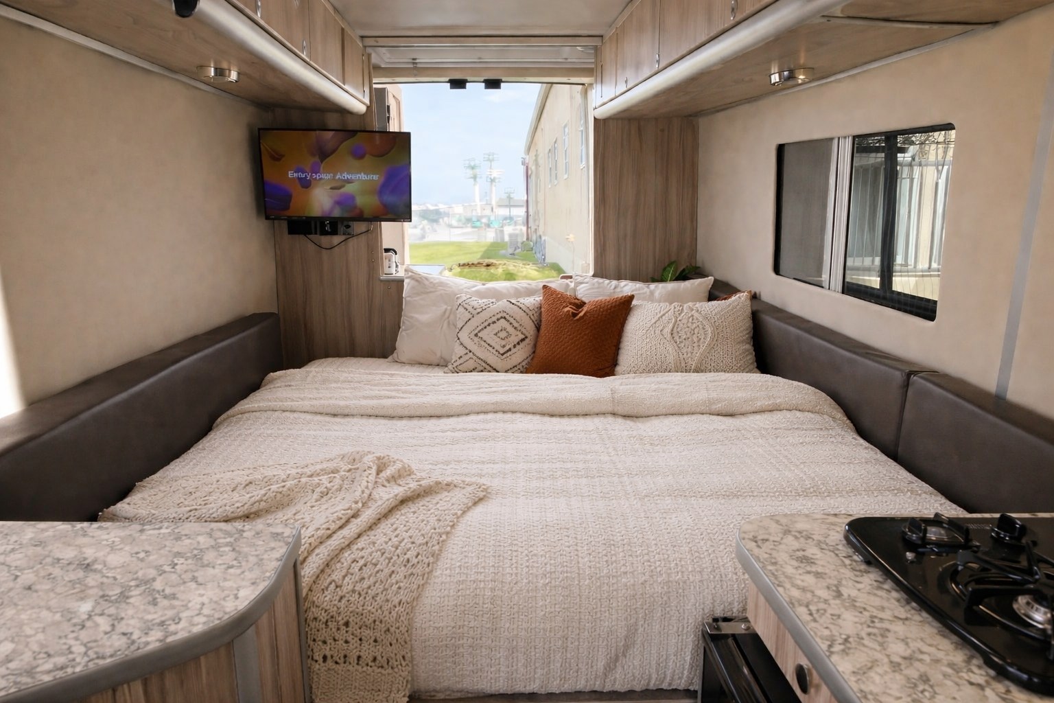 Your next RV rental adventure starts here! This cozy interior boasts a large bed, TV, and kitchenette for ultimate comfort.. Hymer Hymer Class B 2018