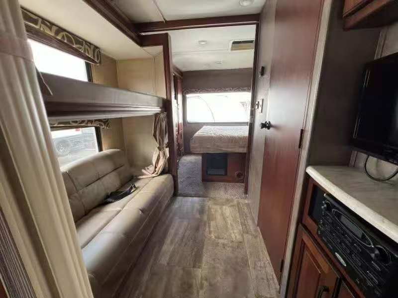 Inside this cozy rv rental, discover bunk beds, a sofa, and a main bedroom area, complete with an entertainment center.. Forest River forester 2017