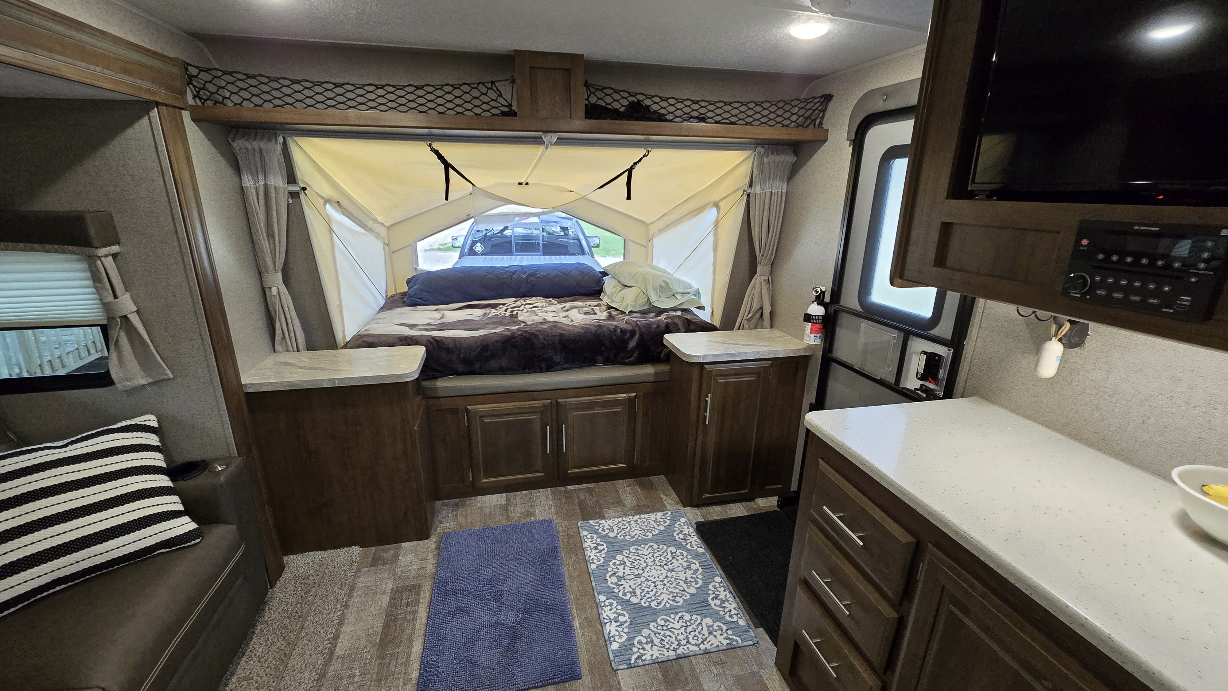 Explore this inviting rv rental. Features a unique pop-out bed, functional kitchen, and comfortable living area.. Forest River Rockwood Roo 2019