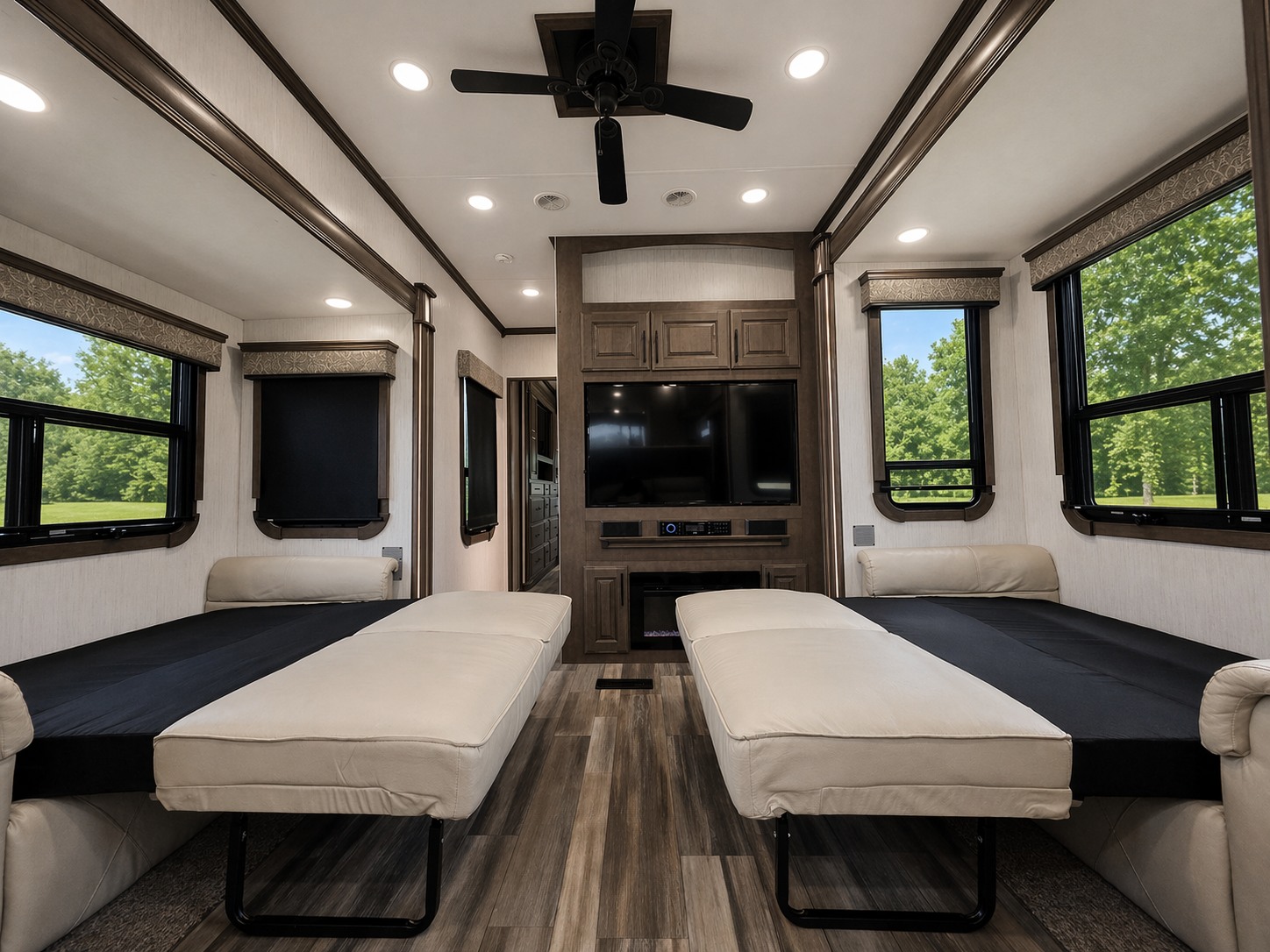 Spacious RV rental interior with two pull-out beds, an entertainment center, and scenic views from windows.. Heartland Landmark 365 2021