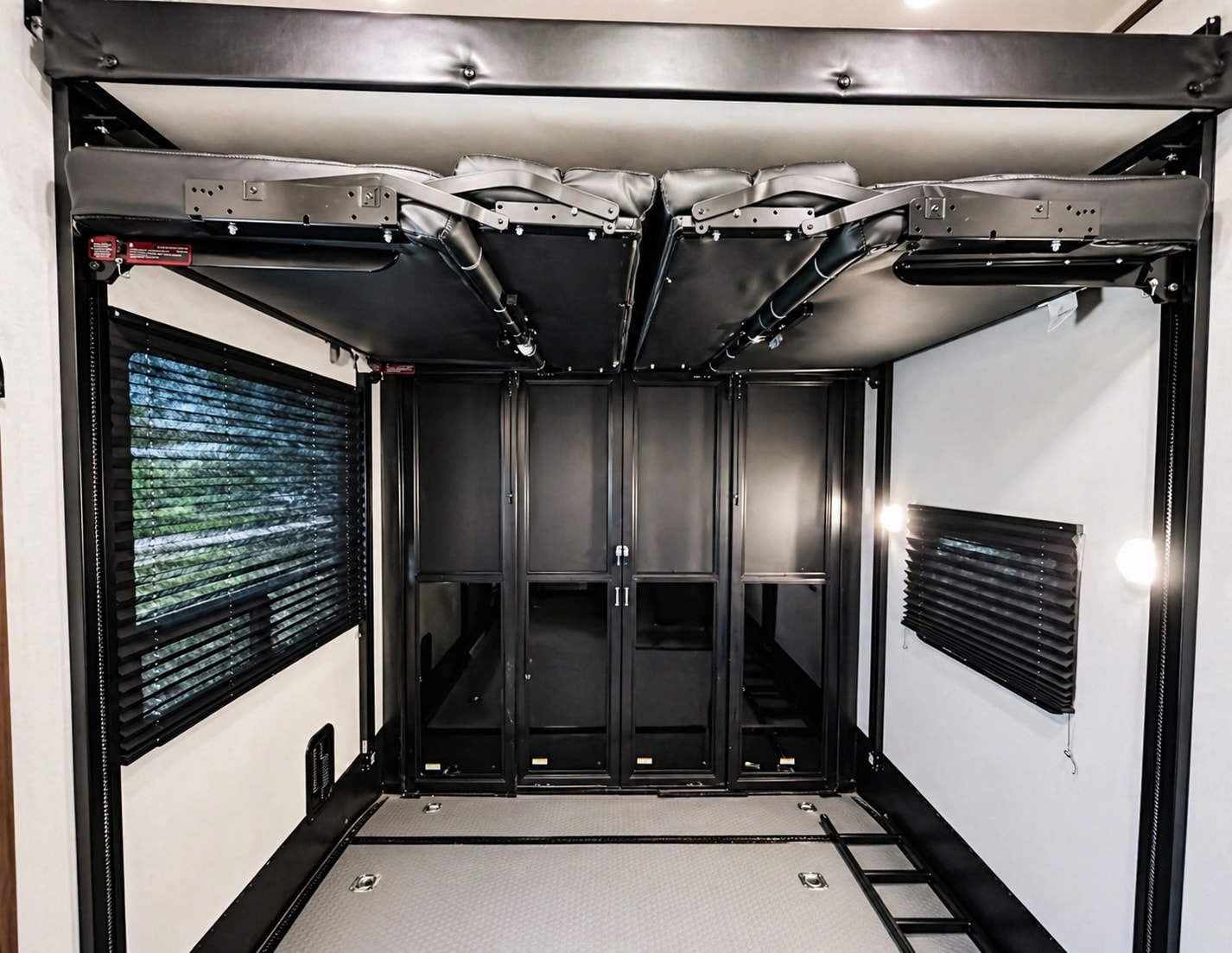 This RV rental's toy hauler garage offers flexible space with a stowable bed/couch system and secure cabinets.. Dutchmen Triton 4271 2022