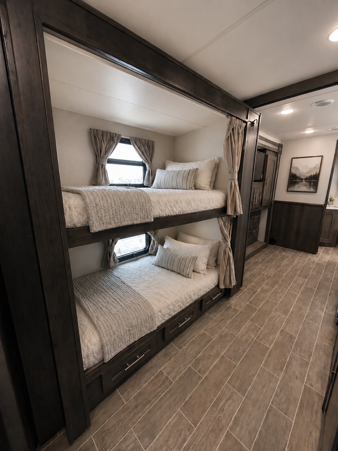 Cozy RV rental bunk beds feature windows, soft bedding, and storage drawers, perfect for a comfortable family trip.. Forest River Georgetown 2020