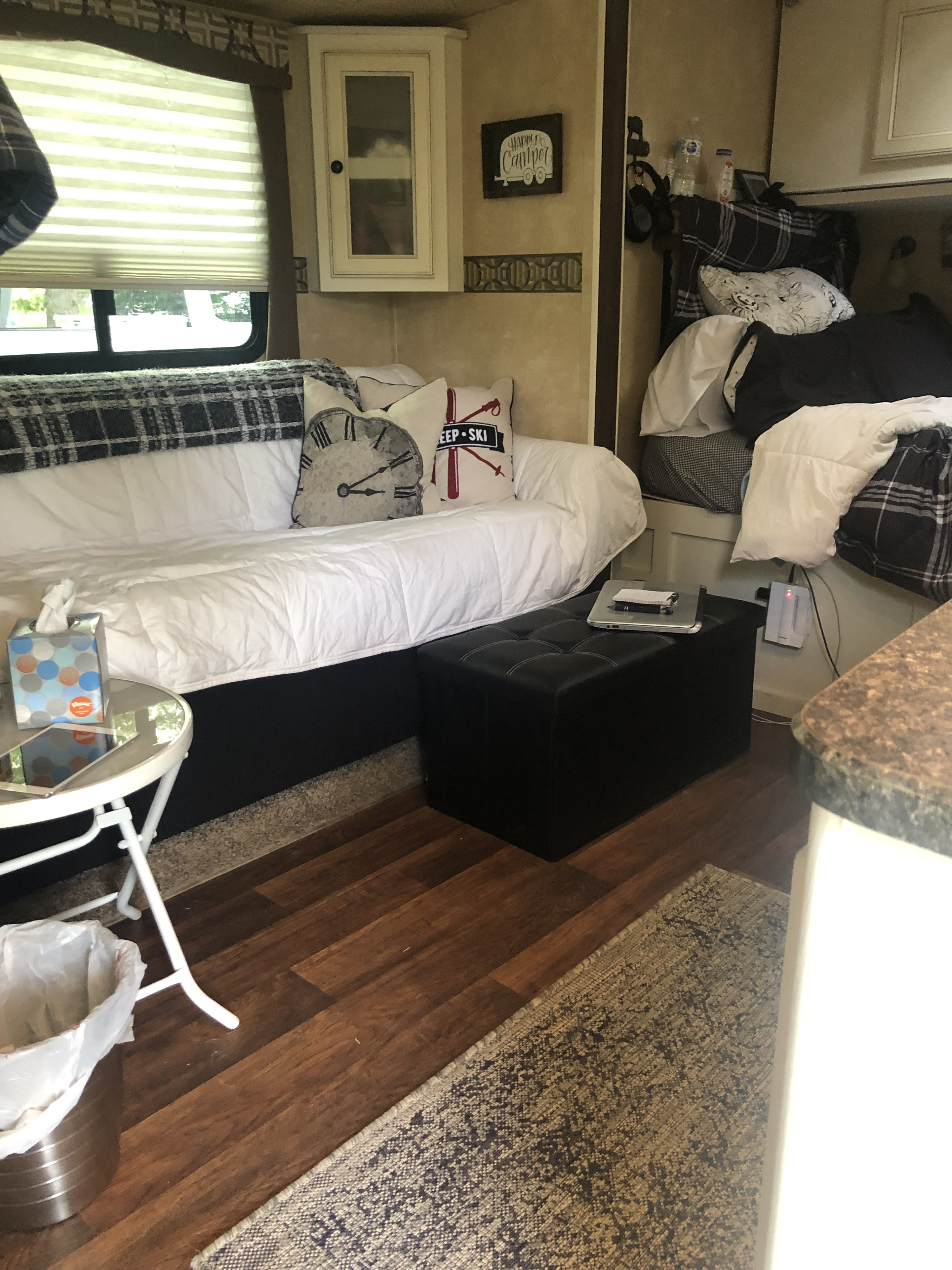 Cozy RV rental interior featuring a daybed, bunk beds, and modern amenities for comfortable travel adventures.. Cruiser RV Fun Finder 2013