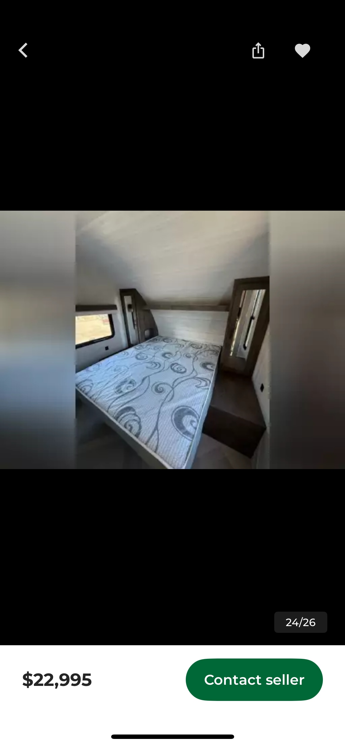 Comfortable RV rental bedroom with a patterned mattress, window, and mirrored wardrobe, perfect for your journey. $22,995.. Forest River Wildwood X-Lite 2022