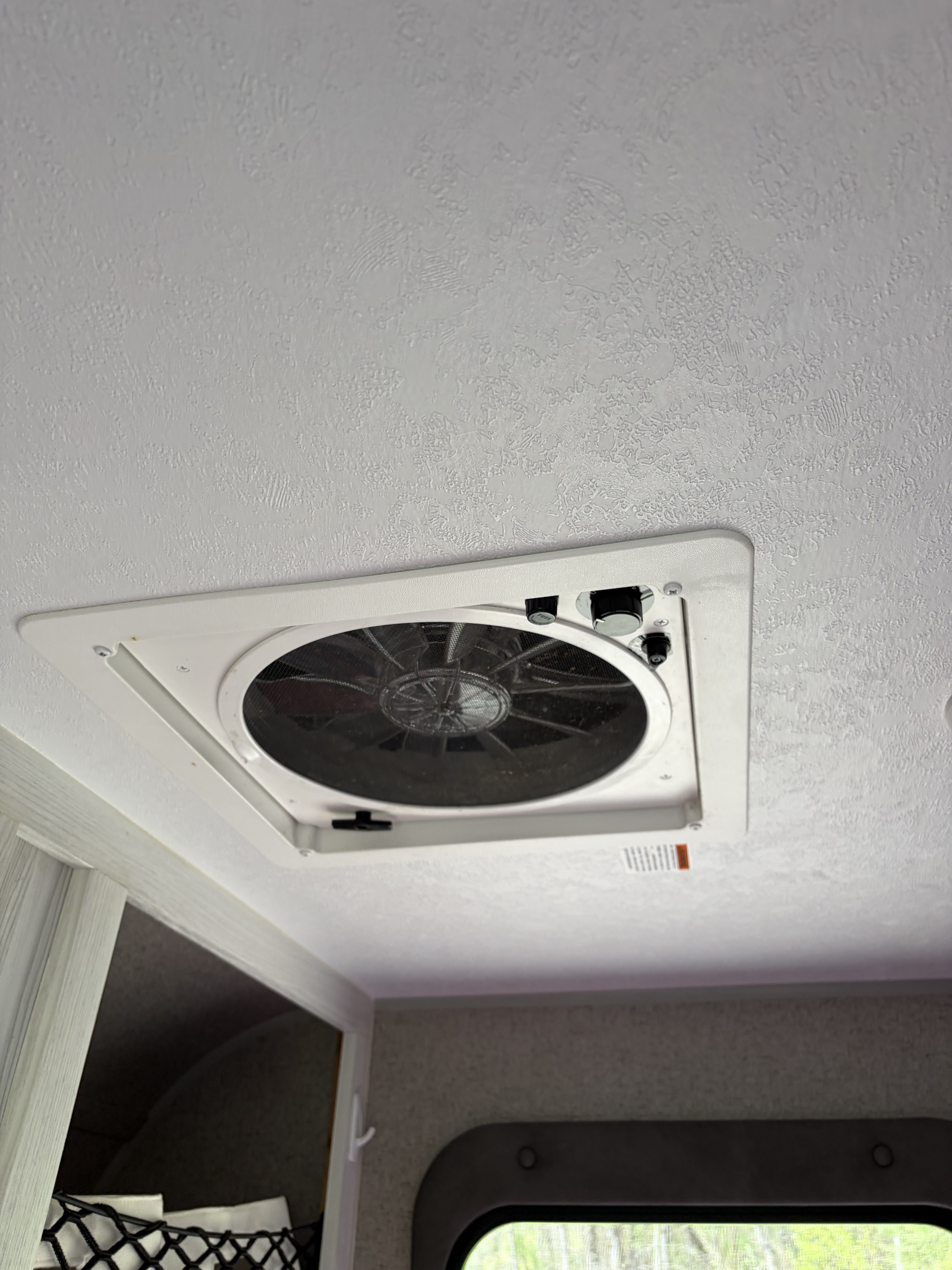 RV rental: Ceiling-mounted white vent fan with accessible speed/direction controls against a textured white ceiling.. Forest River Flagstaff E-Pro 2019