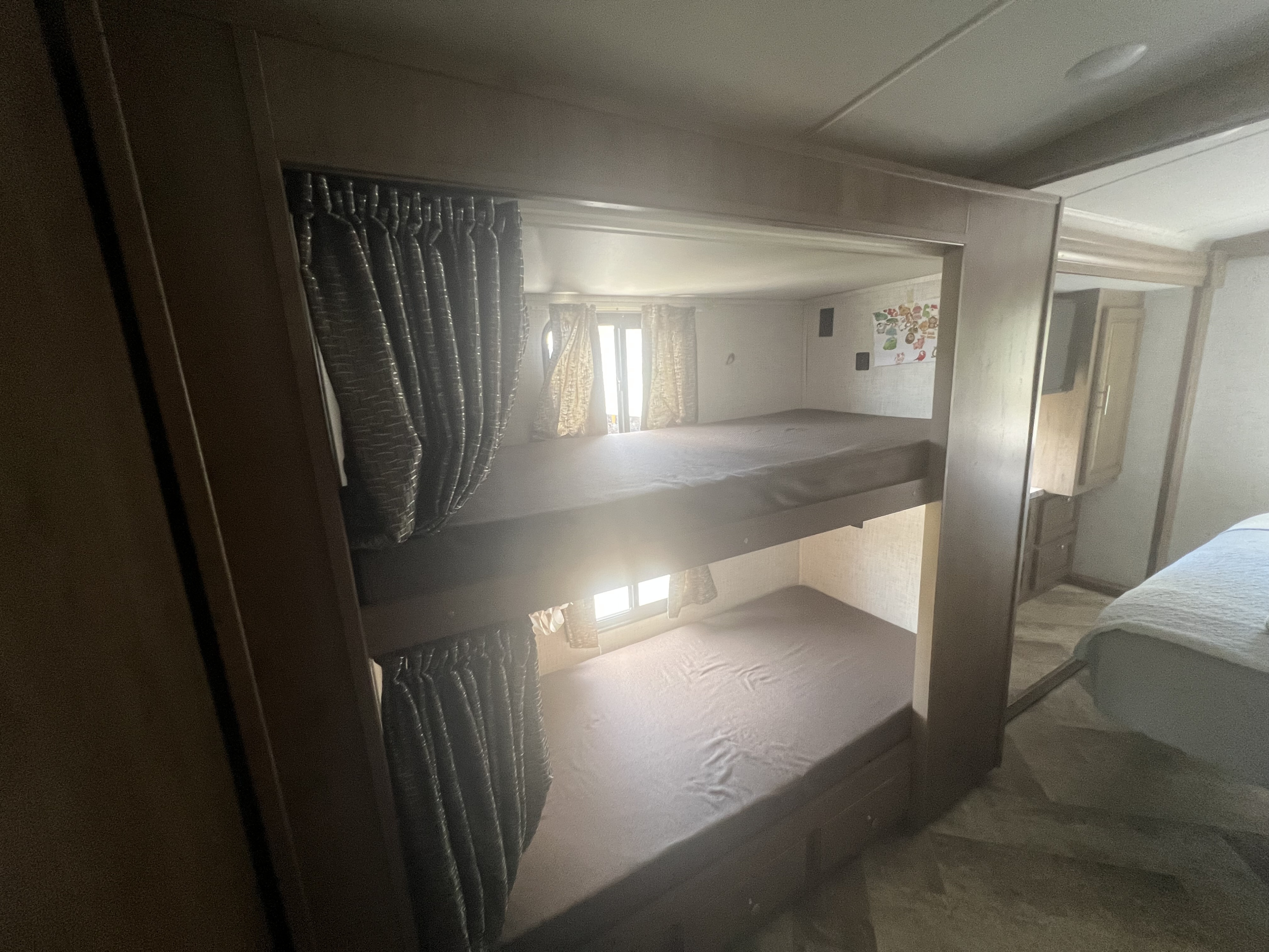Inside this RV rental, comfortable bunk beds with windows and privacy curtains offer cozy sleeping quarters for your next adventure.. Georgetown GT3 2020