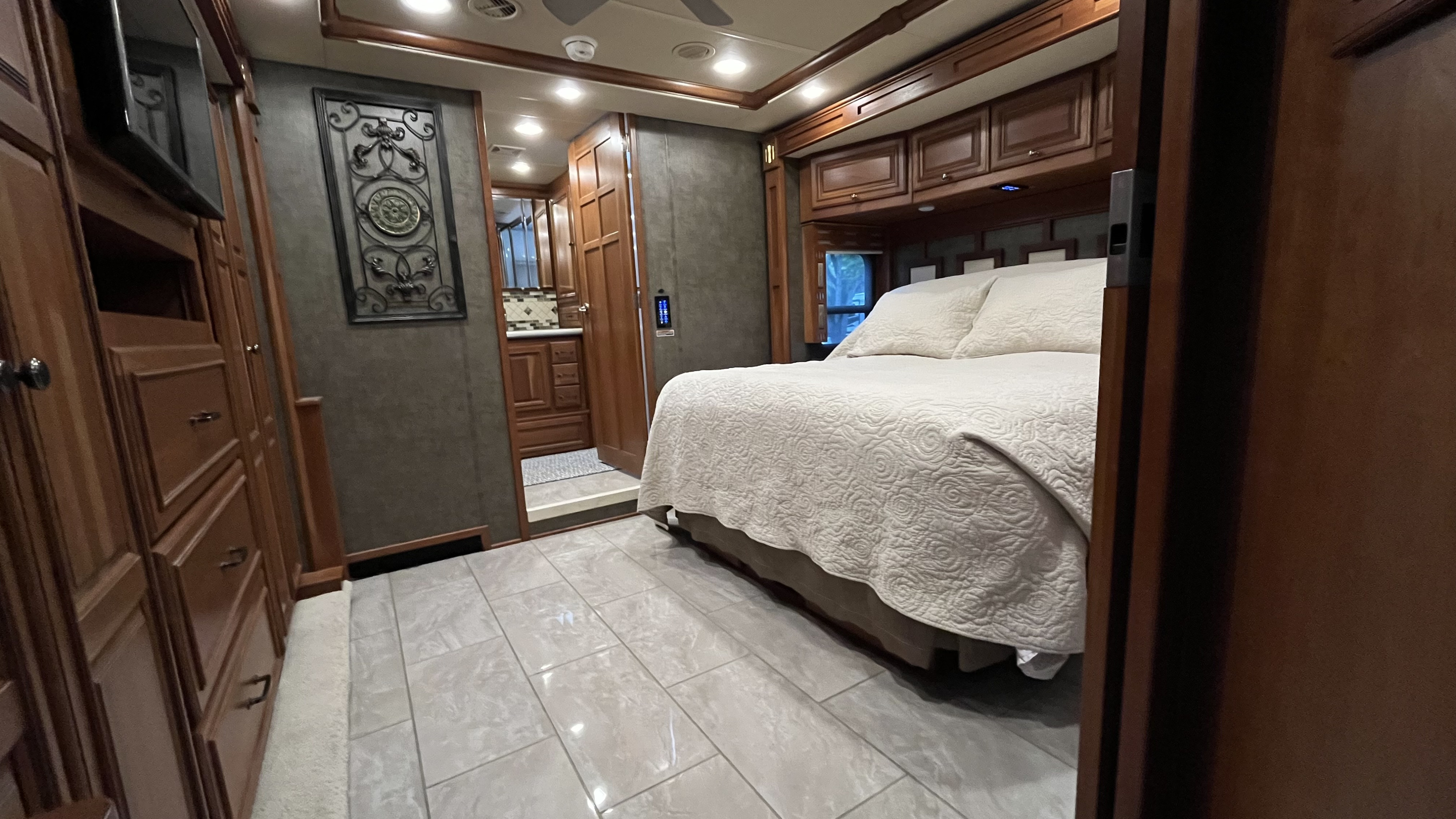 Experience luxury RV rental travel! This motorhome's spacious bedroom offers a comfortable bed, ample storage, and a private bath.. Winnebago Tour 2016